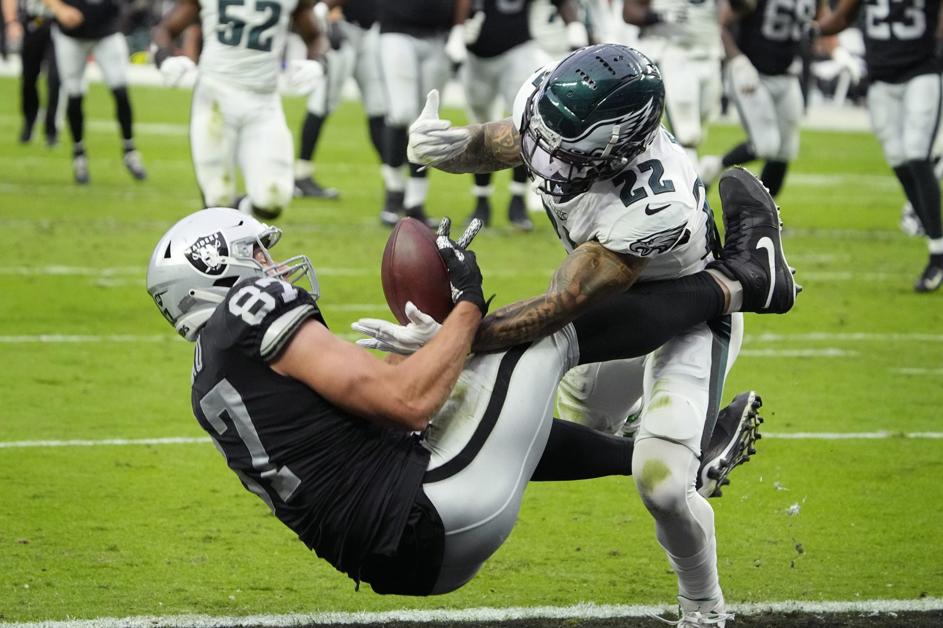 Las Vegas Raiders tight end Foster Moreau (87) catches a pass for a touchdown against Philadelphia Eagles safety Marcus Epps (22) during the first half of an NFL football game, Sunday, Oct. 24, 2021, in Las Vegas.
