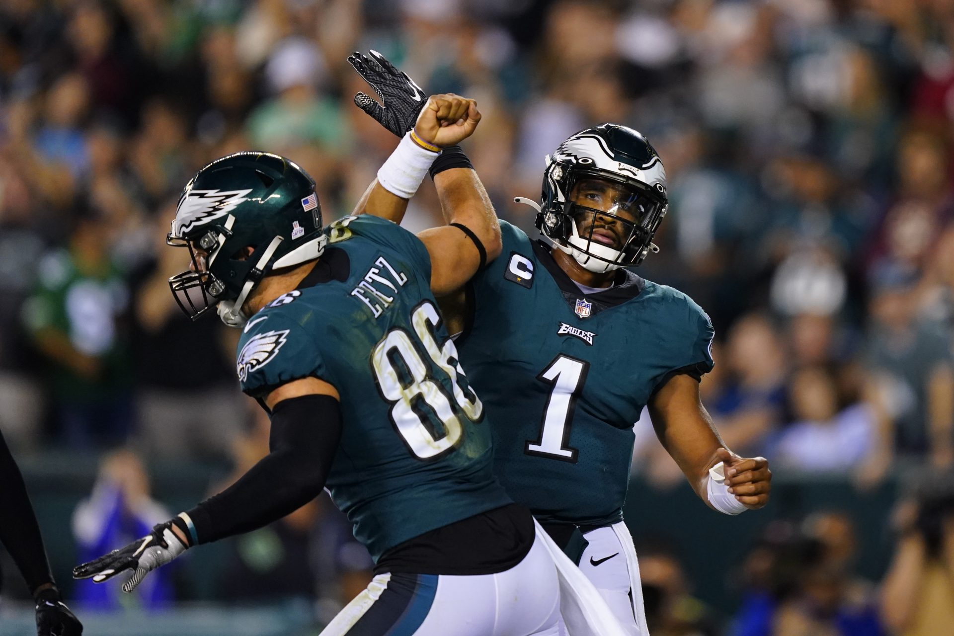 Philadelphia Eagles quarterback Jalen Hurts (1) celebrates his touchdown with Philadelphia Eagles tight end Zach Ertz (86) during the second half of an NFL football game against the Tampa Bay Buccaneers on Thursday, Oct. 14, 2021, in Philadelphia.
