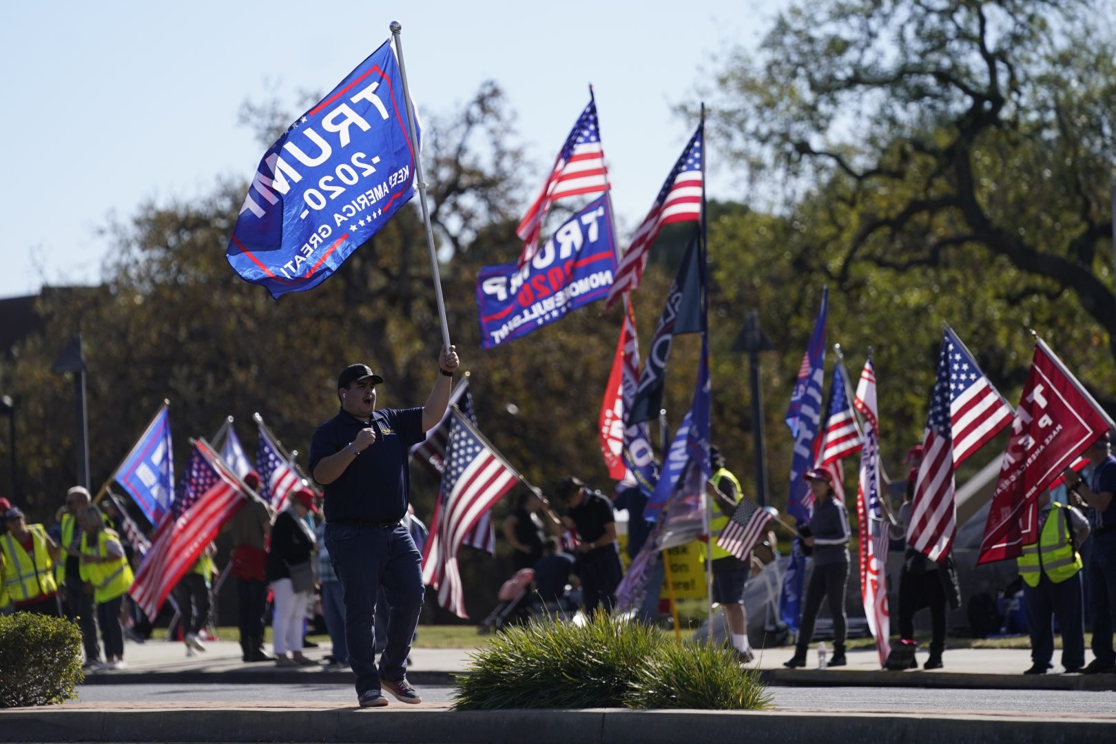 In this Jan. 6, 2021 file photo, people attend a rally in support of President Donald Trump outside Thousand Oaks City Hall  in Thousand Oaks, Calif.  Republicans have had wild success this year passing voting restrictions in states they control politically, from Georgia to Iowa to Texas. 