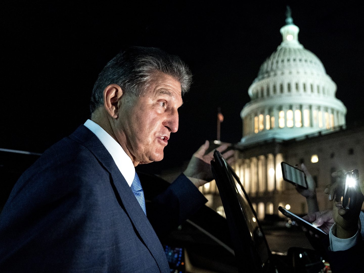 Senator Joe Manchin, a Democrat from West Virginia, speaks to members of the media while departing the U.S. Capitol in Washington, D.C., U.S., on Thursday, Oct. 7, 2021.  Stefani Reynolds/Bloomberg via Getty Images