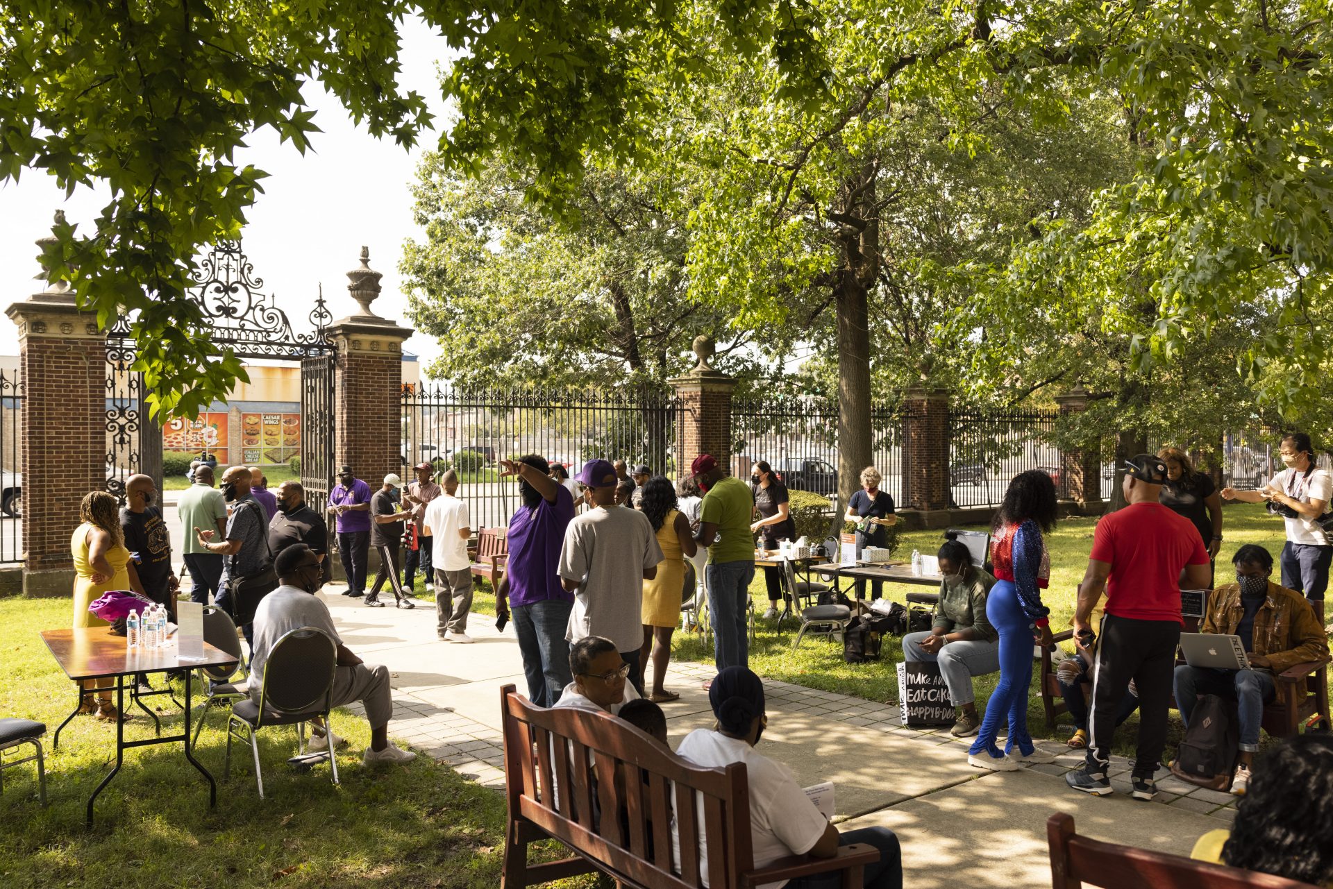 People gather for The Gun Violence Memorial Project set up outside Prince Hall Grand Lodge in Philadelphia on Monday, Aug. 23, 2021. The project collects momentos from families affected by gun violence to display at the National Building Museum in Washington.