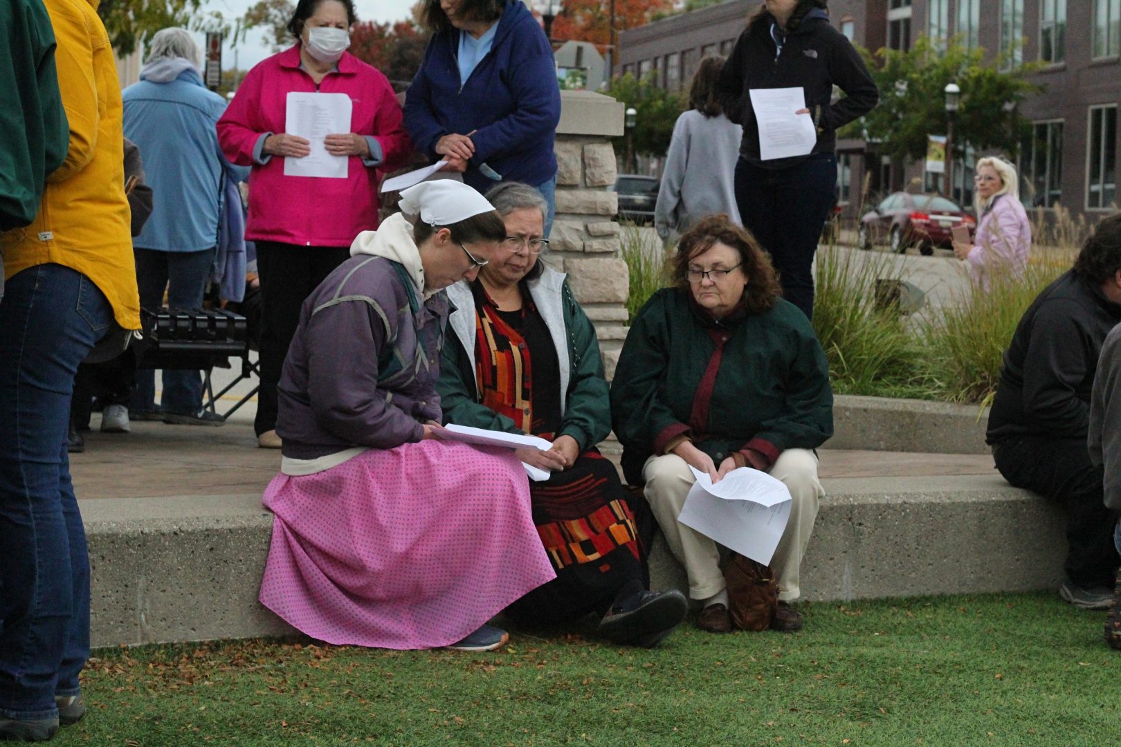 People gather for a vigil in Hart, Mich., on Sunday, Oct. 24, 2021, to pray for the return of 17 members of a missionary group who were kidnapped by a gang in Haiti more than a week ago. Among those taken were four children and a parent from Hart. 