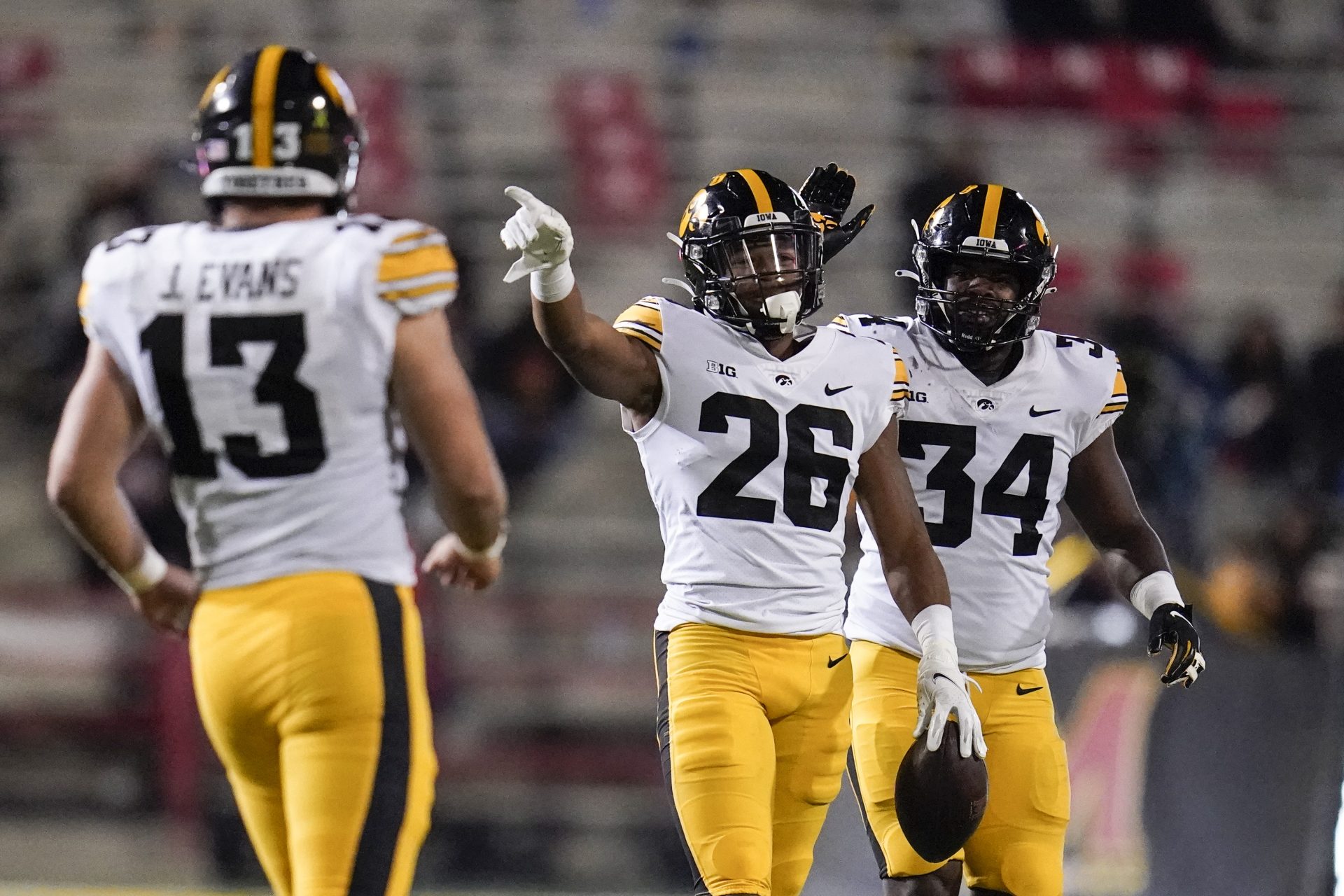 Iowa defensive back Kaevon Merriweather (26) reacts after making an interception on a pass from Maryland quarterback Taulia Tagovailoa, not visible, during the second half of an NCAA college football game in College Park, Md., in this Friday, Oct. 1, 2021.