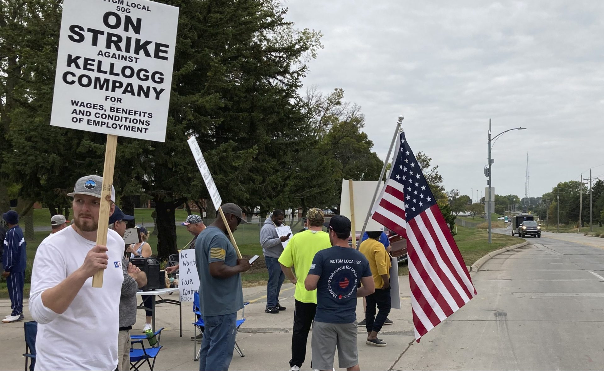 Workers from a Kellogg's cereal plant picket along the main rail lines leading into the facility on Wednesday, Oct. 6, 2021, in Omaha, Neb. Workers have gone on strike after a breakdown in contract talks with company management.