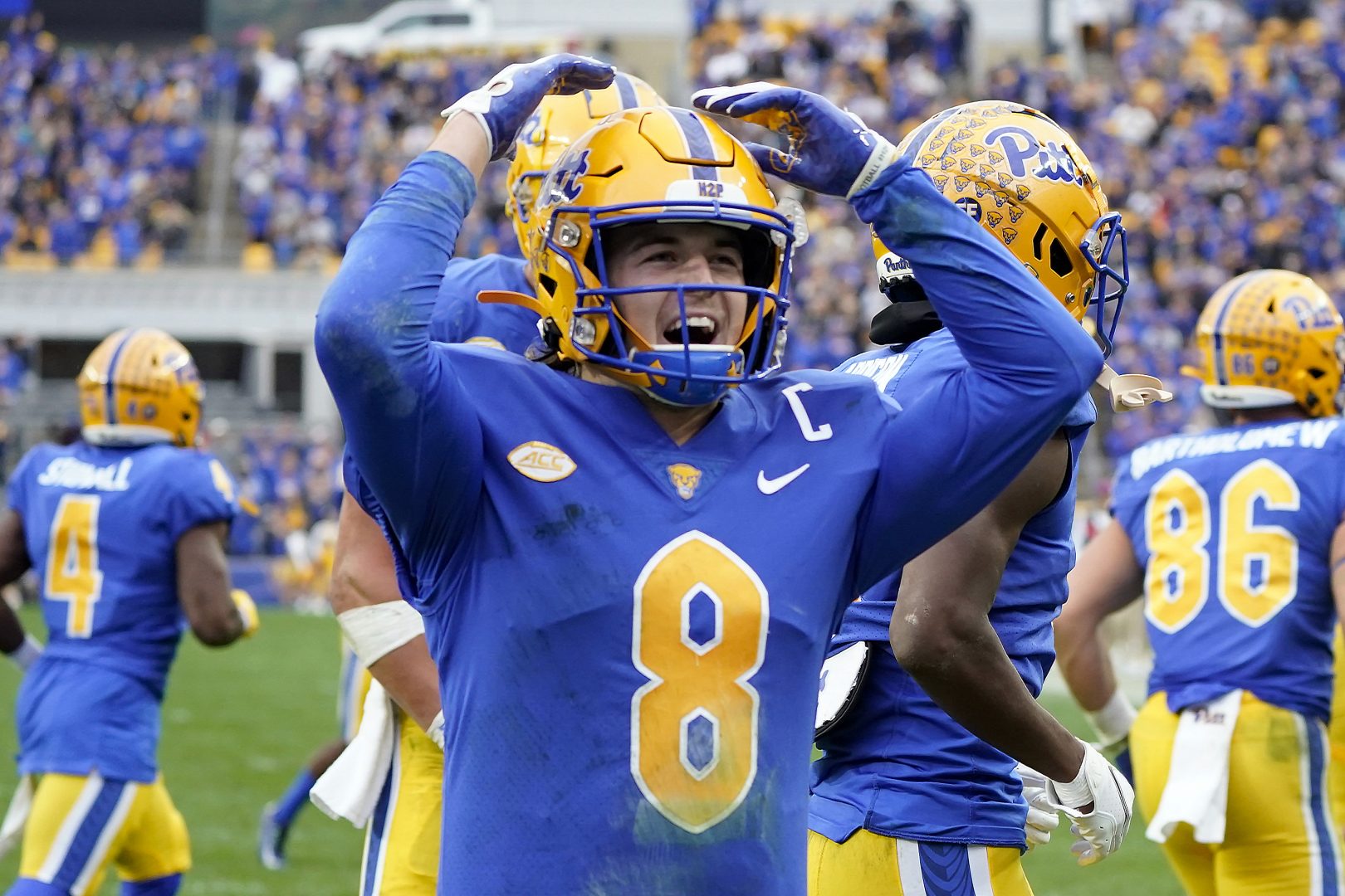 Pittsburgh quarterback Kenny Pickett (8) celebrates after throwing him a touchdown pass to wide receiver Jordan Addison (3) during the first half of an NCAA college football game against Clemson, Saturday, Oct. 23, 2021, in Pittsburgh. 