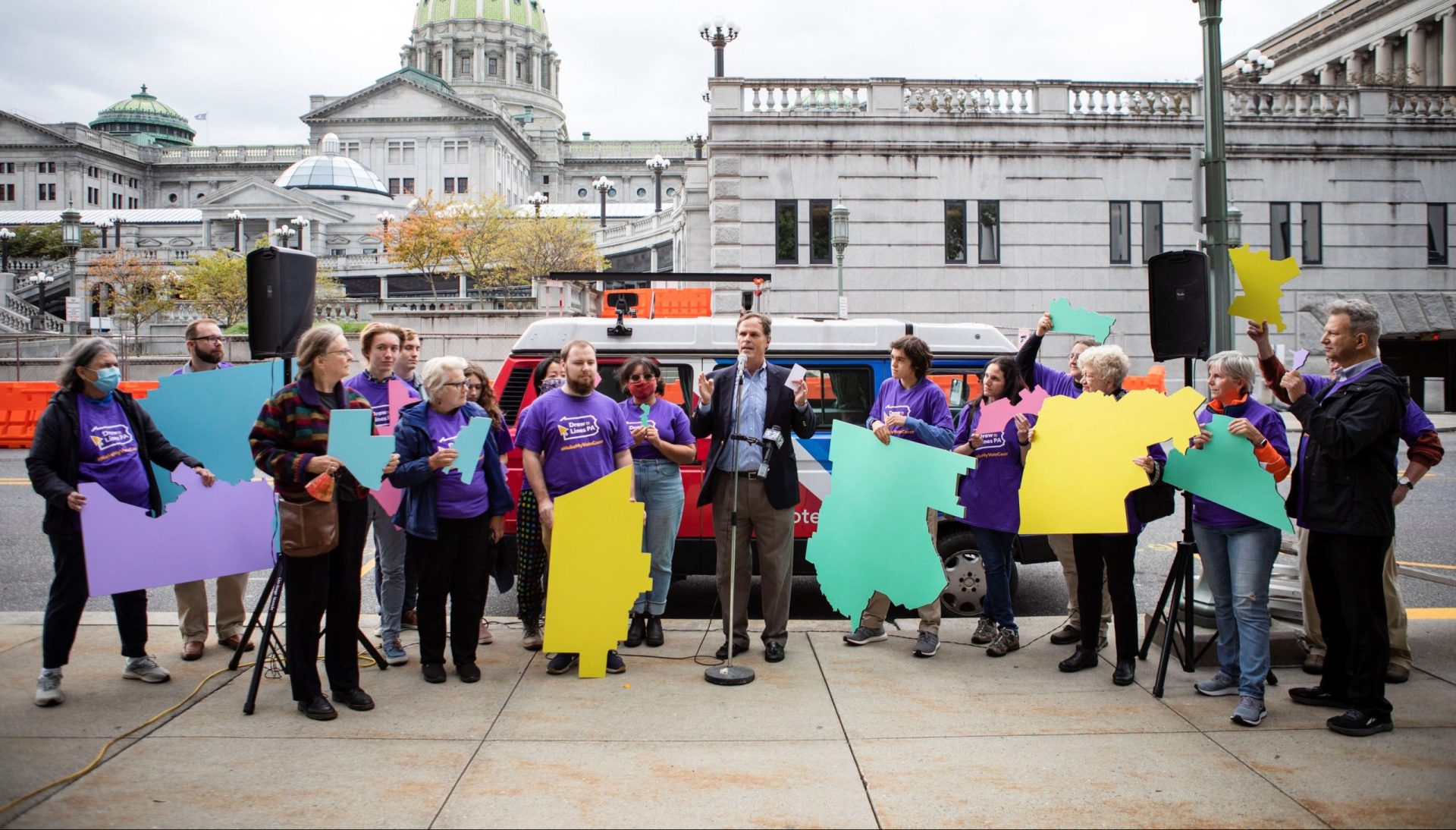 Members of the Draw the Lines initiative gathered outside the Capitol in late October to call on legislators to produce a fair congressional district map via a transparent process.