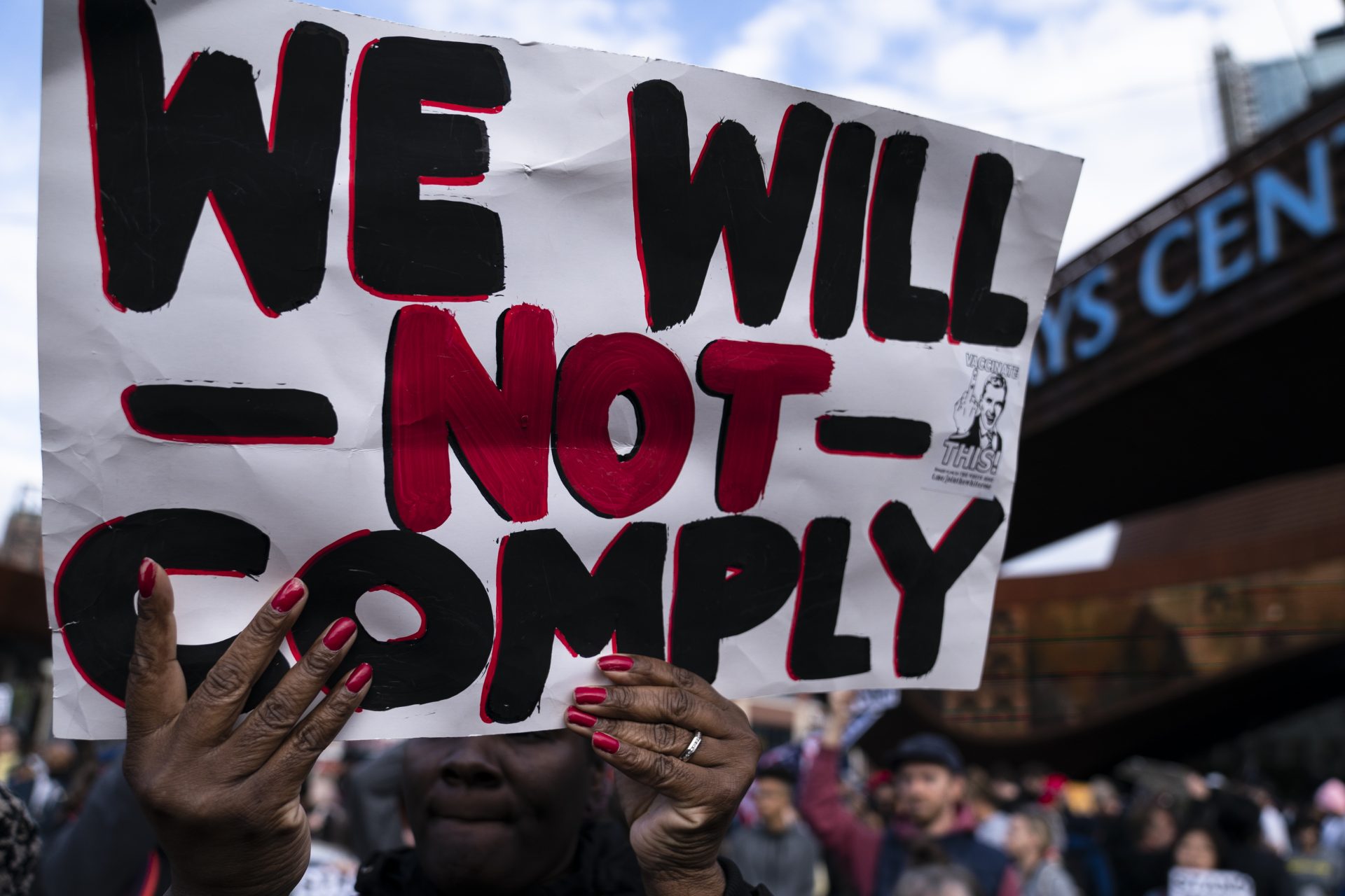 Protesters rallying against COVID-19 vaccination mandates gather in the street outside the Barclays Center before an NBA basketball game between the Brooklyn Nets and the Charlotte Hornets, Sunday, Oct. 24, 2021, in New York.