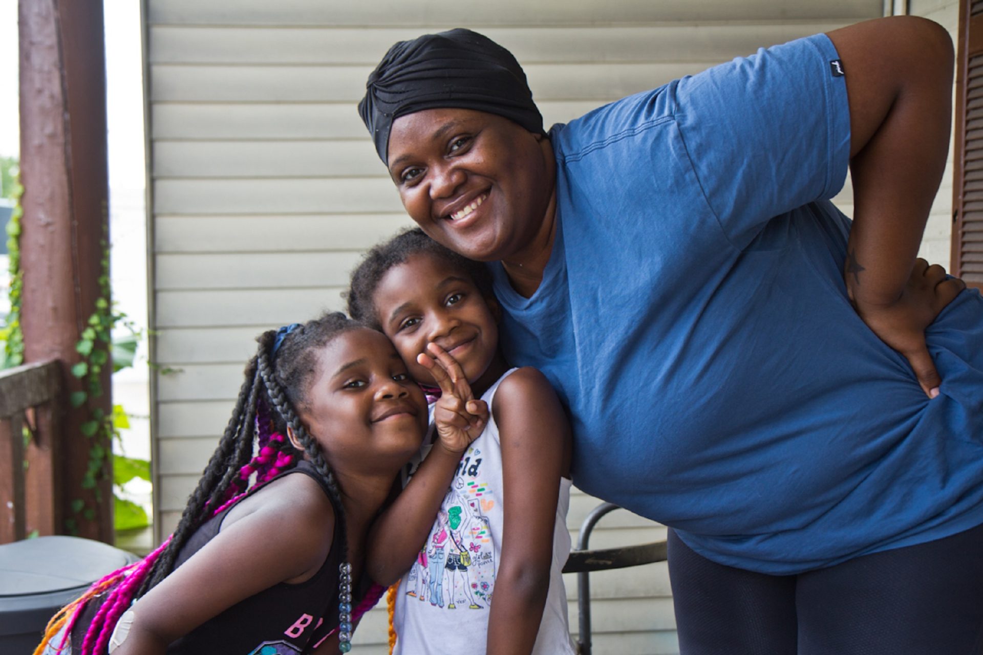 Antonia Gunter, a child tax credit recipient, with her twin daughters Gabriella and Isabella, 6, outside their home in Philadelphia.