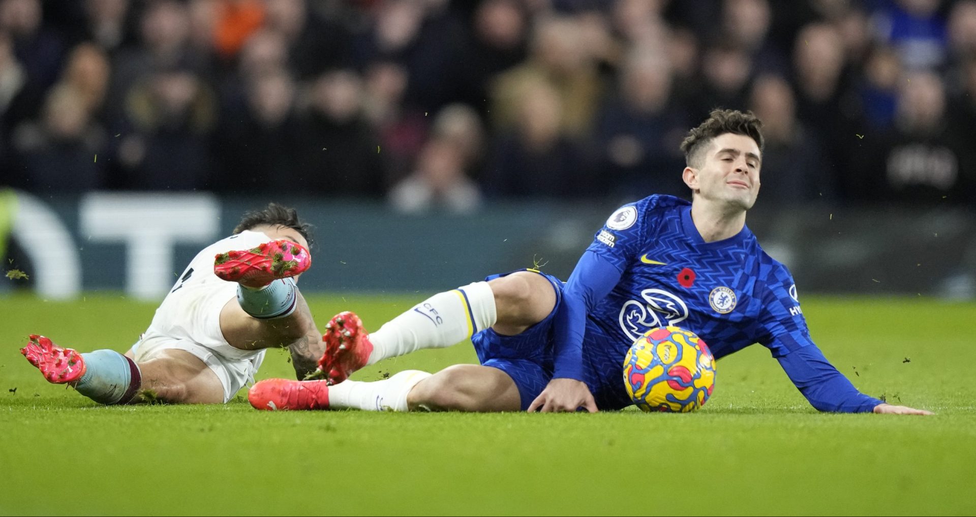 Burnley's Josh Brownhill, left, fights for the ball with Chelsea's Christian Pulisic during the English Premier League soccer match between Chelsea and Burnley at the Stamford Bridge stadium in London, Saturday, Nov. 6, 2021. 