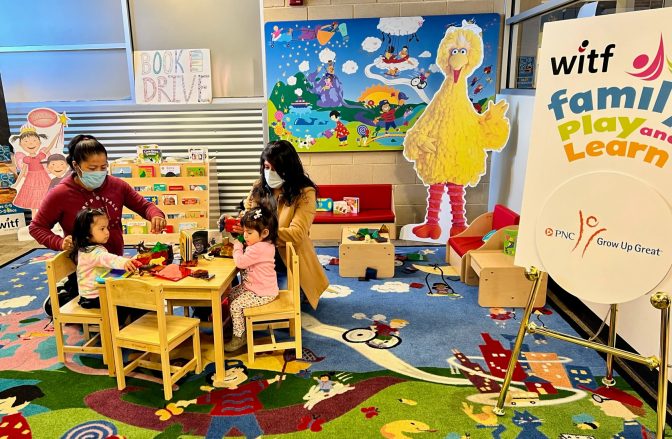 Two families play with magnetic blocks, toys and books at the new WITF Family Play and Learn located in Hamilton Health Center. WITF Family Play and Learn spaces, supported by the PNC Foundation, offer opportunities for young learners and their families to engage in meaningful, educational activities during what would otherwise be unstructured waiting time.