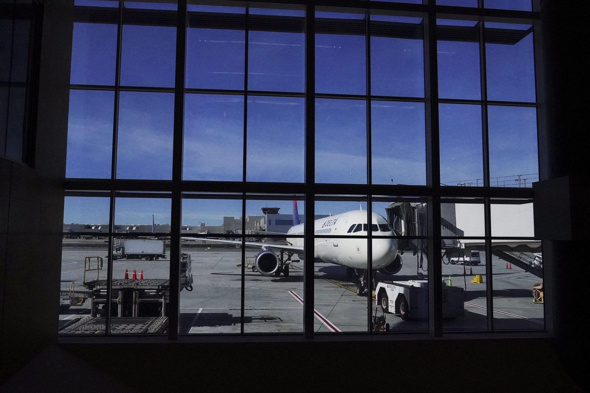 A plane prepares for a flight during holiday travel at the Hartsfield-Jackson Atlanta International Airport on Nov. 23, 2021, in Atlanta.