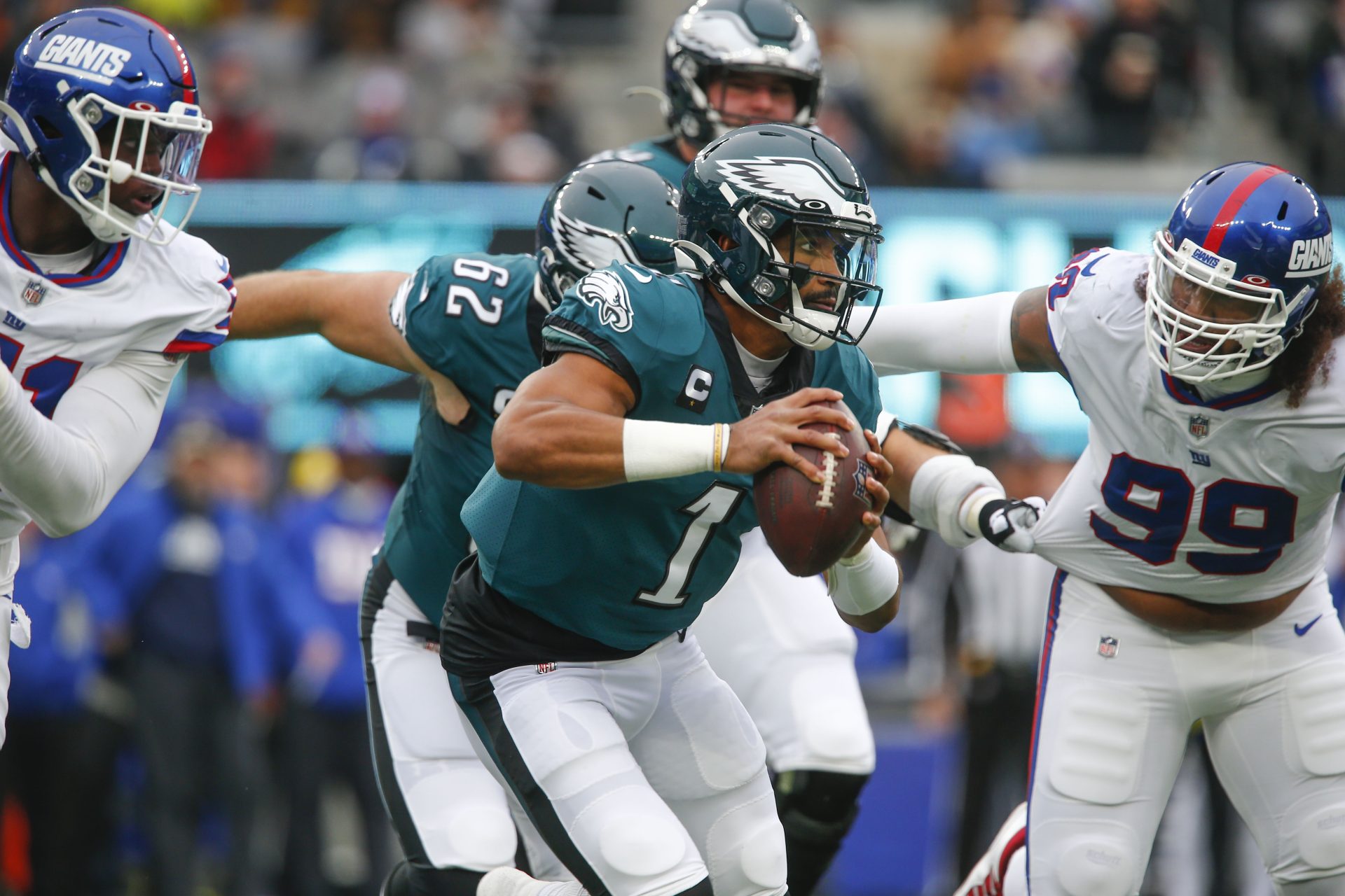Philadelphia Eagles quarterback Jalen Hurts runs the ball during the first half of an NFL football game against the New York Giants, Sunday, Nov. 28, 2021, in East Rutherford, N.J.
