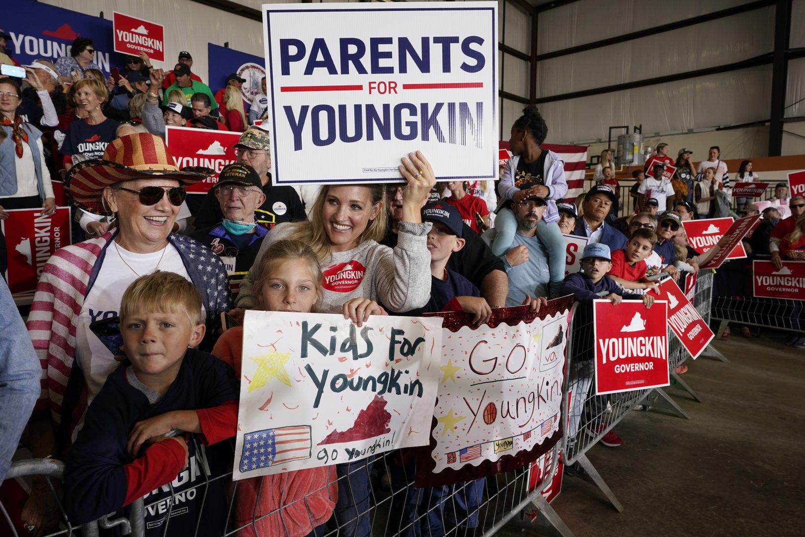 Supporters of Republican gubernatorial candidate Glenn Youngkin cheer on their candidate during a rally in Chesterfield, Va., Monday, Nov. 1, 2021. Youngkin will face Democrat former Gov. Terry McAuliffe in the November election. 