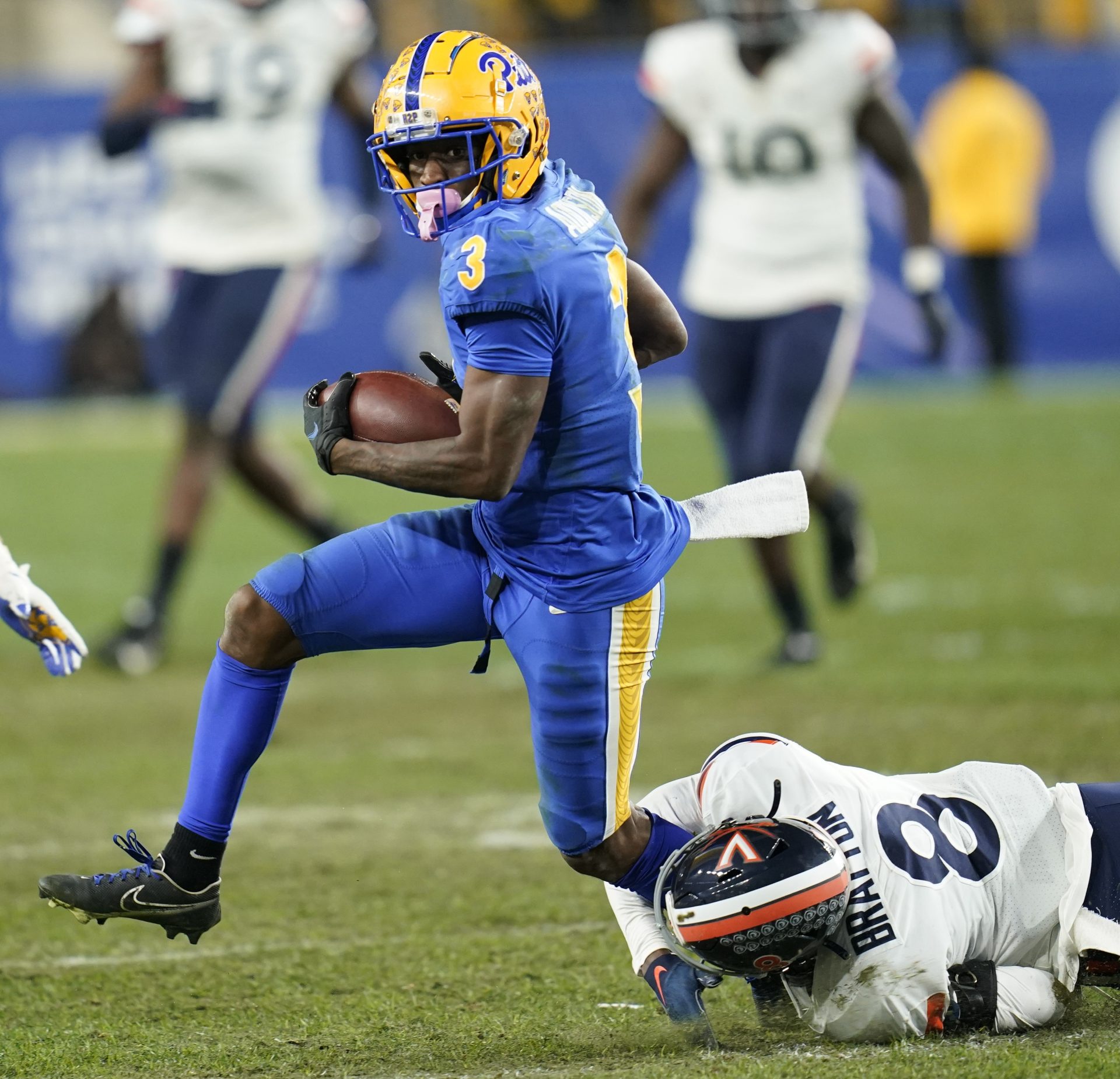 ittsburgh wide receiver Jordan Addison (3) evades Virginia cornerback Darrius Bratton (8) after making a catchy and takes it all the way for a touchdown during the second half of an NCAA college football game Saturday, Nov. 20, 2021, in Pittsburgh. Pittsburgh won 48-38.