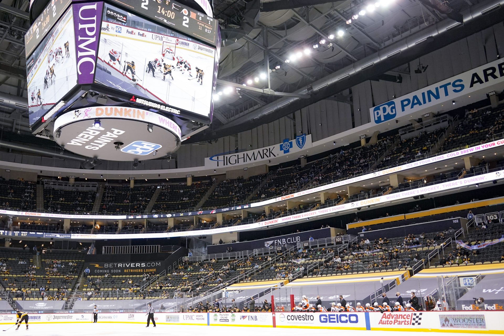 The teams preparing for a face-off are displayed on the video screen on the scoreboard at PPG Paints Arena during the second period of an NHL hockey game between the Pittsburgh Penguins and the Philadelphia Flyers, Saturday, March 6, 2021, in Pittsburgh.