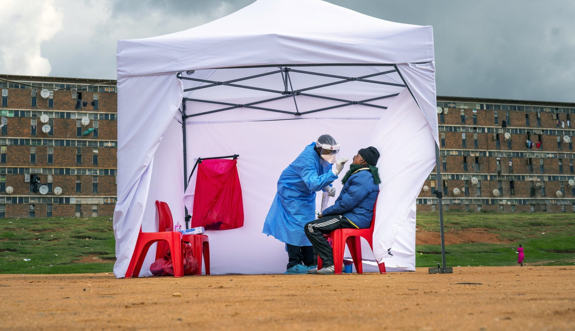 FILE -A resident from the Alexandra township gets tested for COVID-19 , in Johannesburg, Wednesday, April 29, 2020. A new coronavirus variant has been detected in South Africa that scientists say is a concern because of its high number of mutations and rapid spread among young people in Gauteng, the country's most populous province. 