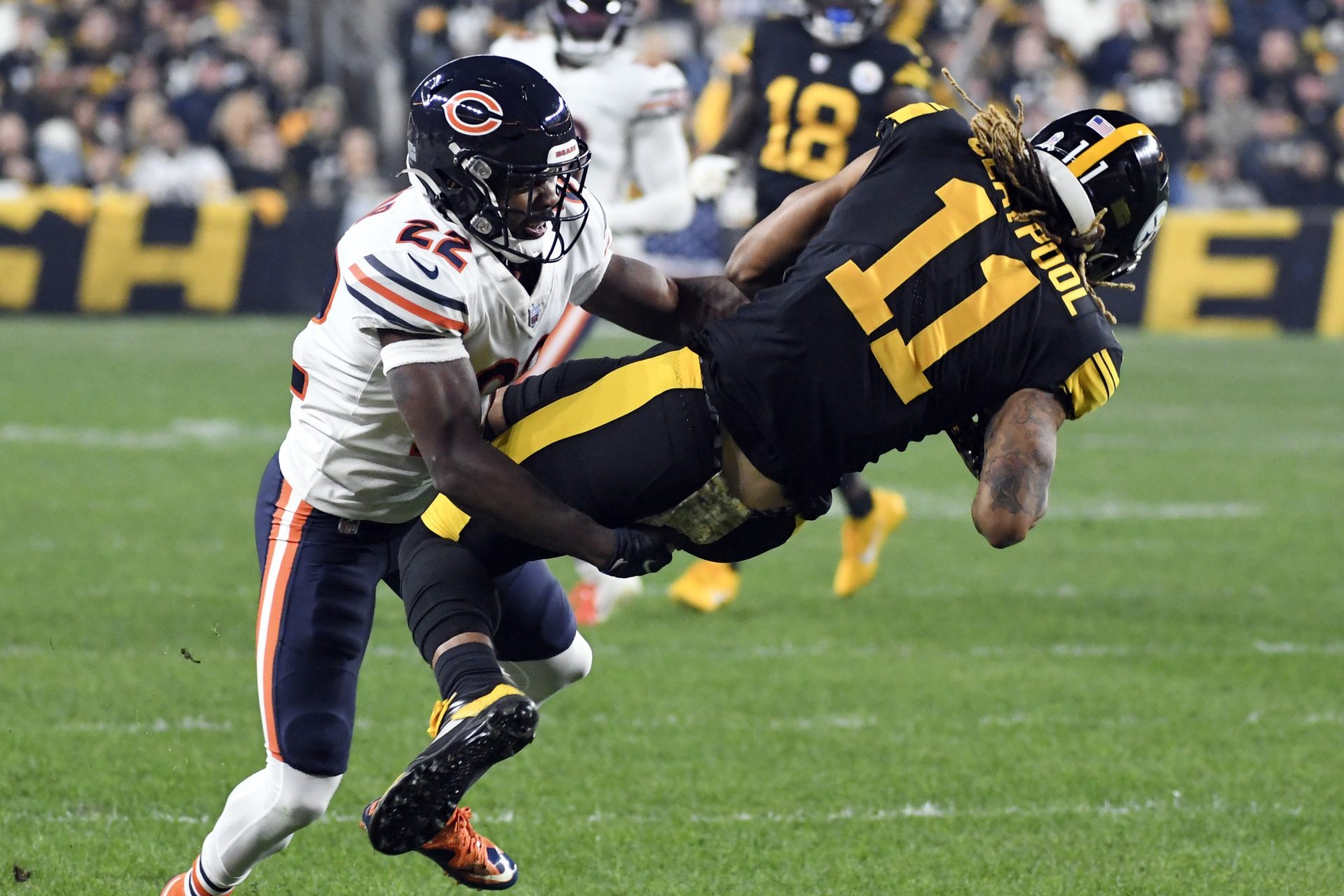 Pittsburgh Steelers wide receiver Chase Claypool (11) is tackled by Chicago Bears cornerback Kindle Vildor (22) after making a catch during the first half an NFL football game, Monday, Nov. 8, 2021, in Pittsburgh.