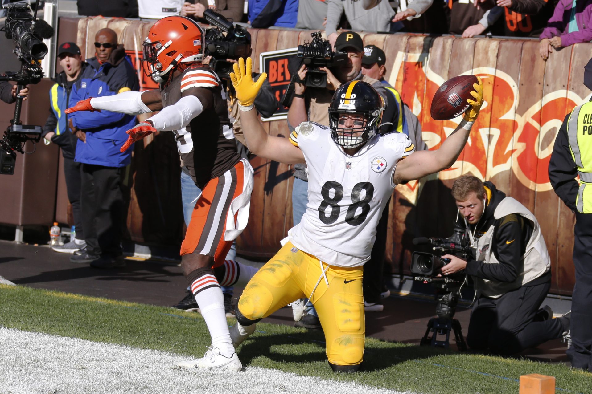 Pittsburgh Steelers tight end Pat Freiermuth, right, celebrates after a 2-yard touchdown pass against Cleveland Browns defensive back Ronnie Harrison, left, during the second half of an NFL football game Sunday, Oct. 31, 2021, in Cleveland.