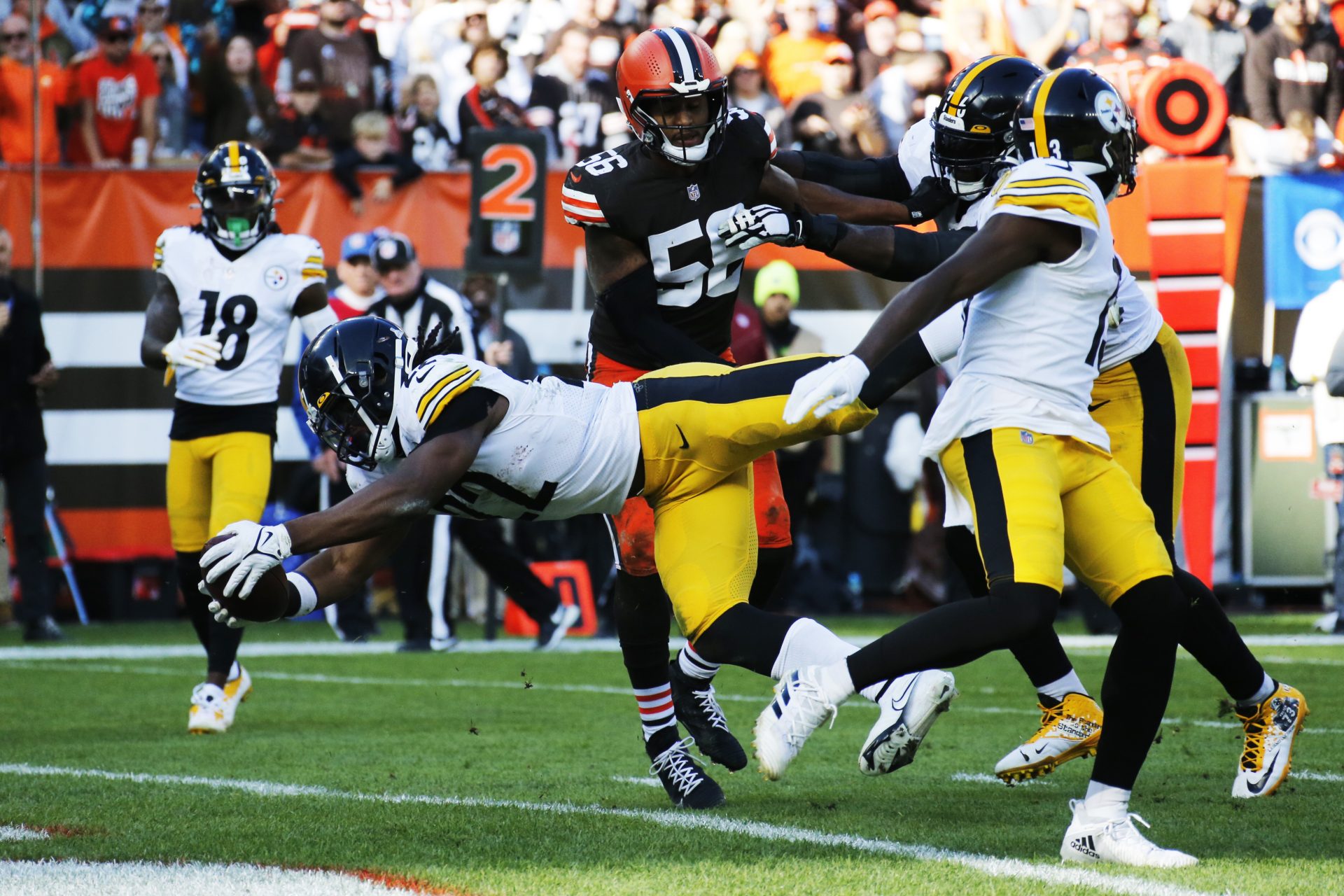 Pittsburgh Steelers running back Najee Harris (22) dives into the end zone for an 8-yard touchdown during the second half of an NFL football game against the Cleveland Browns, Sunday, Oct. 31, 2021, in Cleveland.
