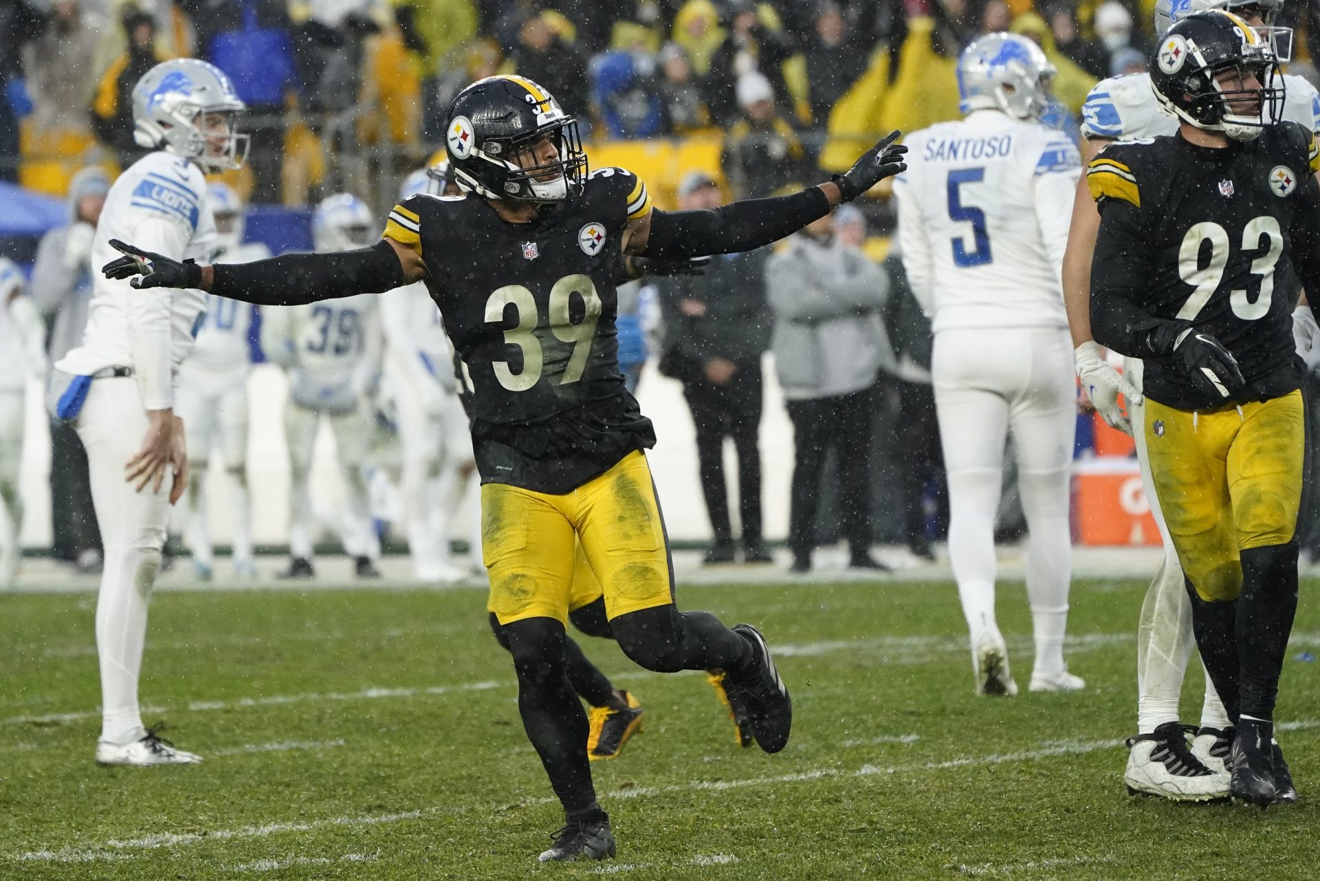 Detroit Lions kicker Ryan Santoso (5) walks off the field after missing a field goal-attempt, as Pittsburgh Steelers free safety Minkah Fitzpatrick (39) celebrates during the overtime period of an NFL football game, Sunday, Nov. 14, 2021, in Pittsburgh.