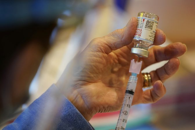 In this Dec. 29, 2020, file photo a Chester County, Pa., Health Department worker fills a syringe with Moderna COVID-19 vaccine before administering it at the Chester County Government Services Center in West Chester, Pa.