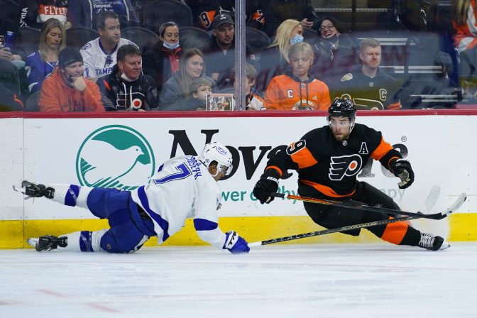 Tampa Bay Lightning's Mathieu Joseph, left, and Philadelphia Flyers' Ivan Provorov collide during the third period of an NHL hockey game, Sunday, Dec. 5, 2021, in Philadelphia.