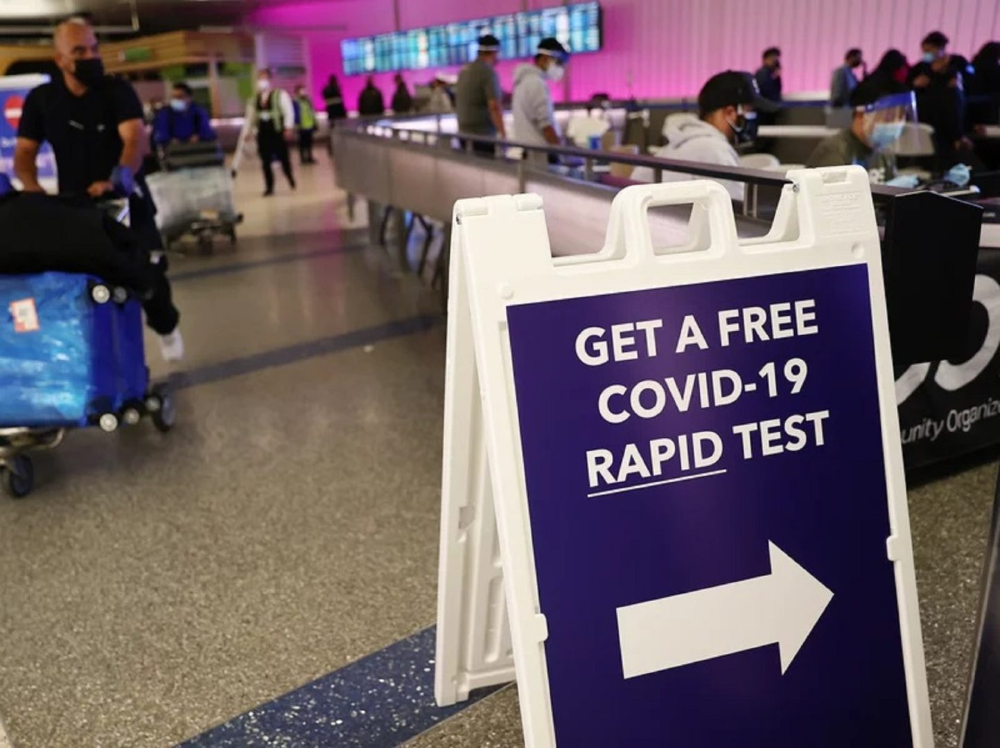 An international passenger arrives near a new rapid COVID-19 testing site for arriving international passengers at Los Angeles International Airport (LAX) on Friday in Los Angeles.
