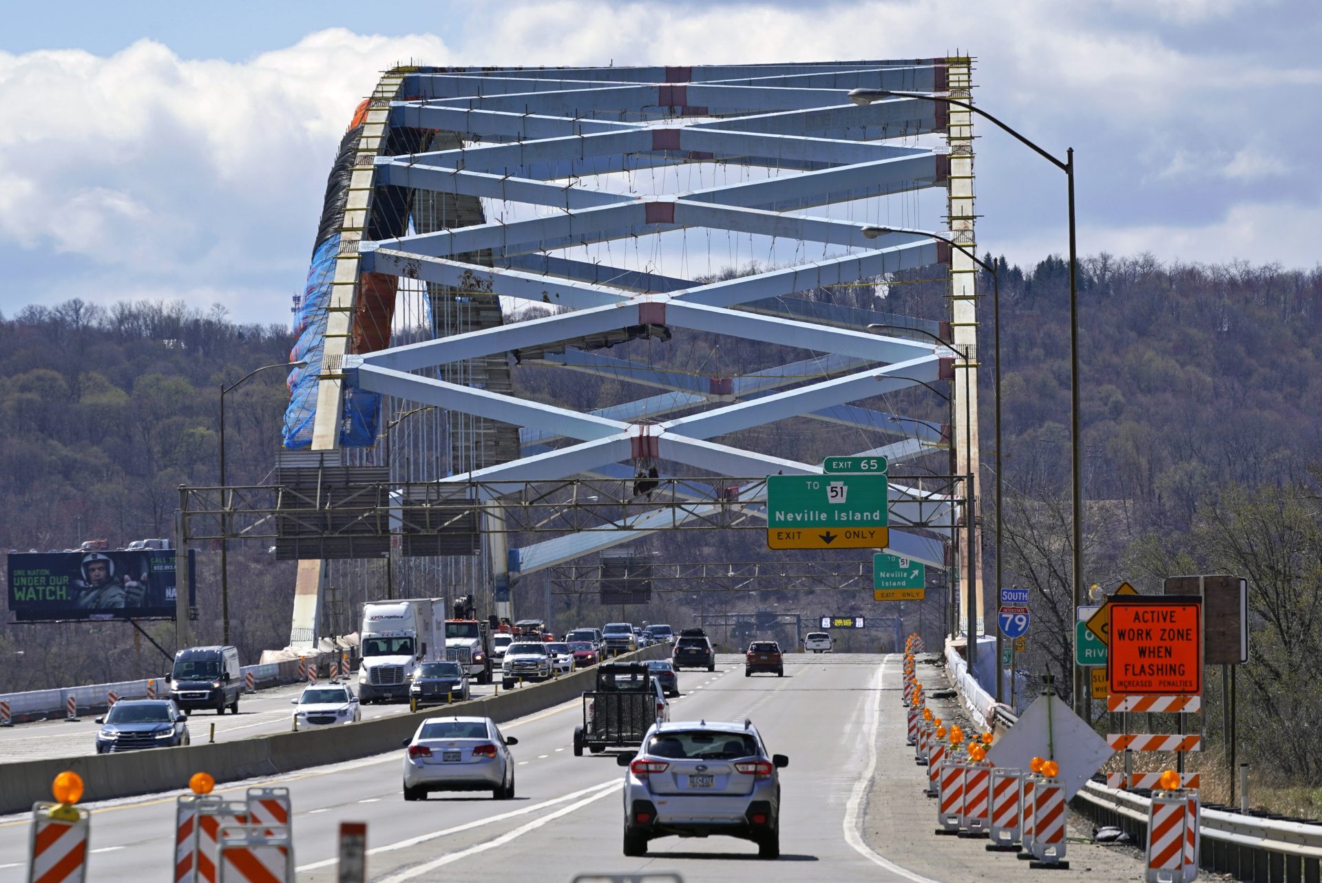 Traffic on Interstate 79 crosses the Ohio River on the Neville Island Bridge as it undergoes a refurbishing near Pittsburgh, April 2, 2021.
