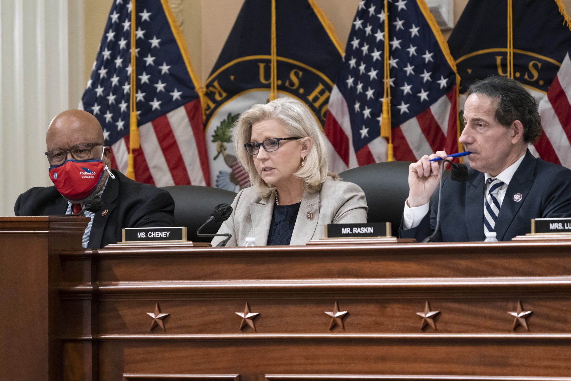 Rep. Liz Cheney, R-Wyo., vice chair of the House panel investigating the Jan. 6 U.S. Capitol insurrection, is flanked by Chairman Bennie Thompson, D-Miss., left, and Rep. Jamie Raskin, D-Md., as they vote on pursuing contempt charges against former President Donald Trump's White House chief of staff Mark Meadows for not complying with a subpoena, at the Capitol in Washington, Monday, Dec. 13, 2021.