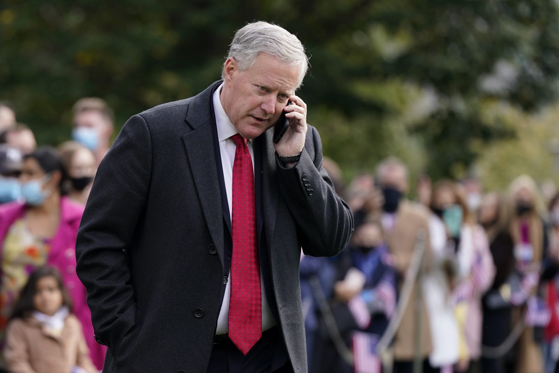 White House chief of staff Mark Meadows speaks on a phone on the South Lawn of the White House in Washington, on Oct. 30, 2020.
