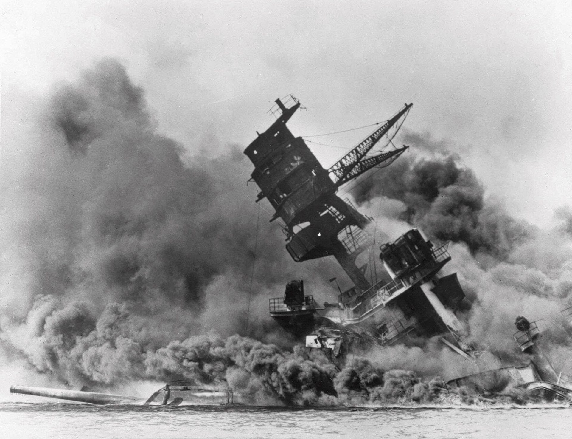 In this Dec. 7, 1941, file photo, smoke rises from the battleship USS Arizona as it sinks during a Japanese surprise attack on Pearl Harbor, Hawaii.