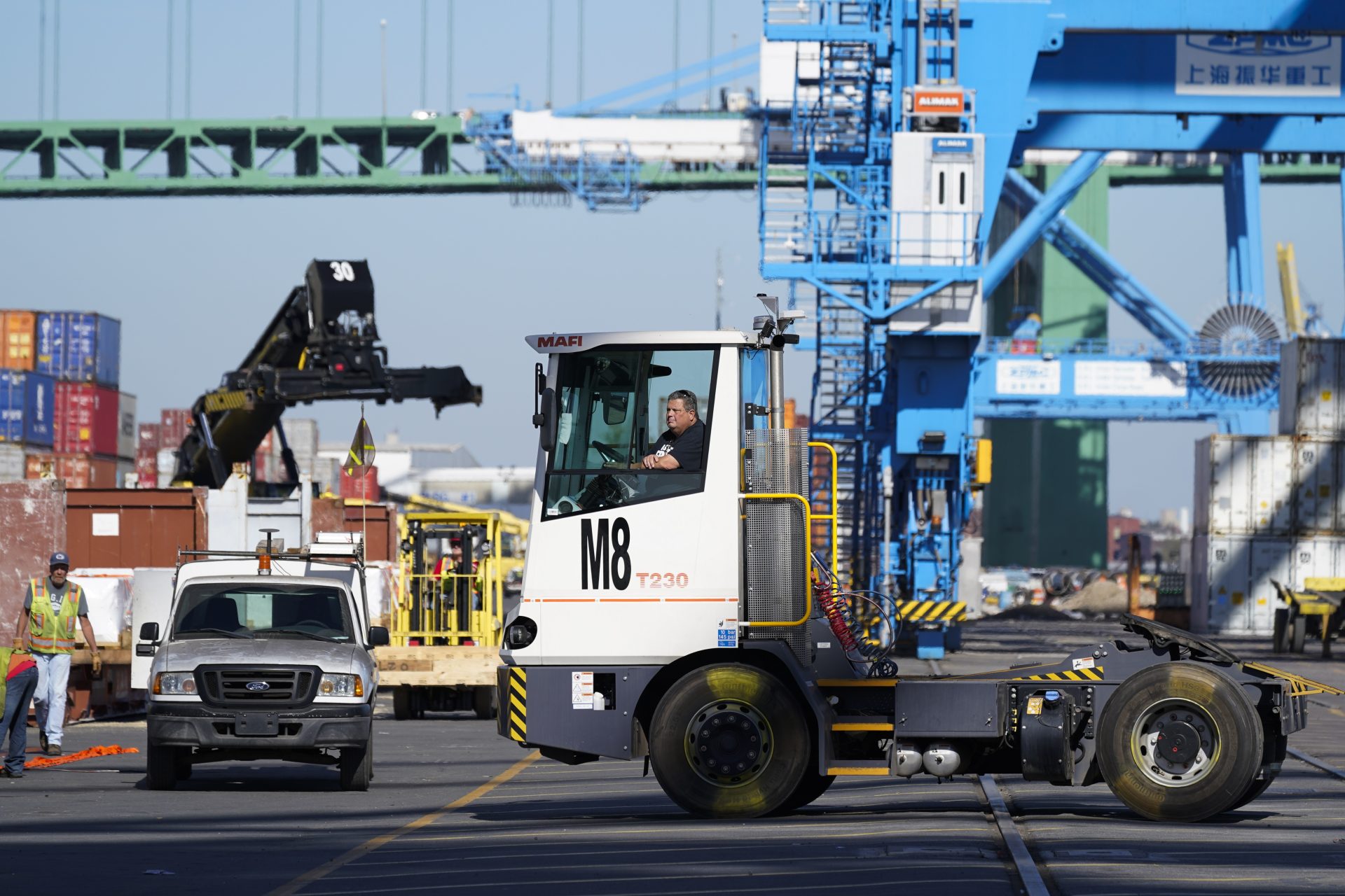 A worker drives a truck at the Port of Philadelphia, Thursday, Oct. 28, 2021.