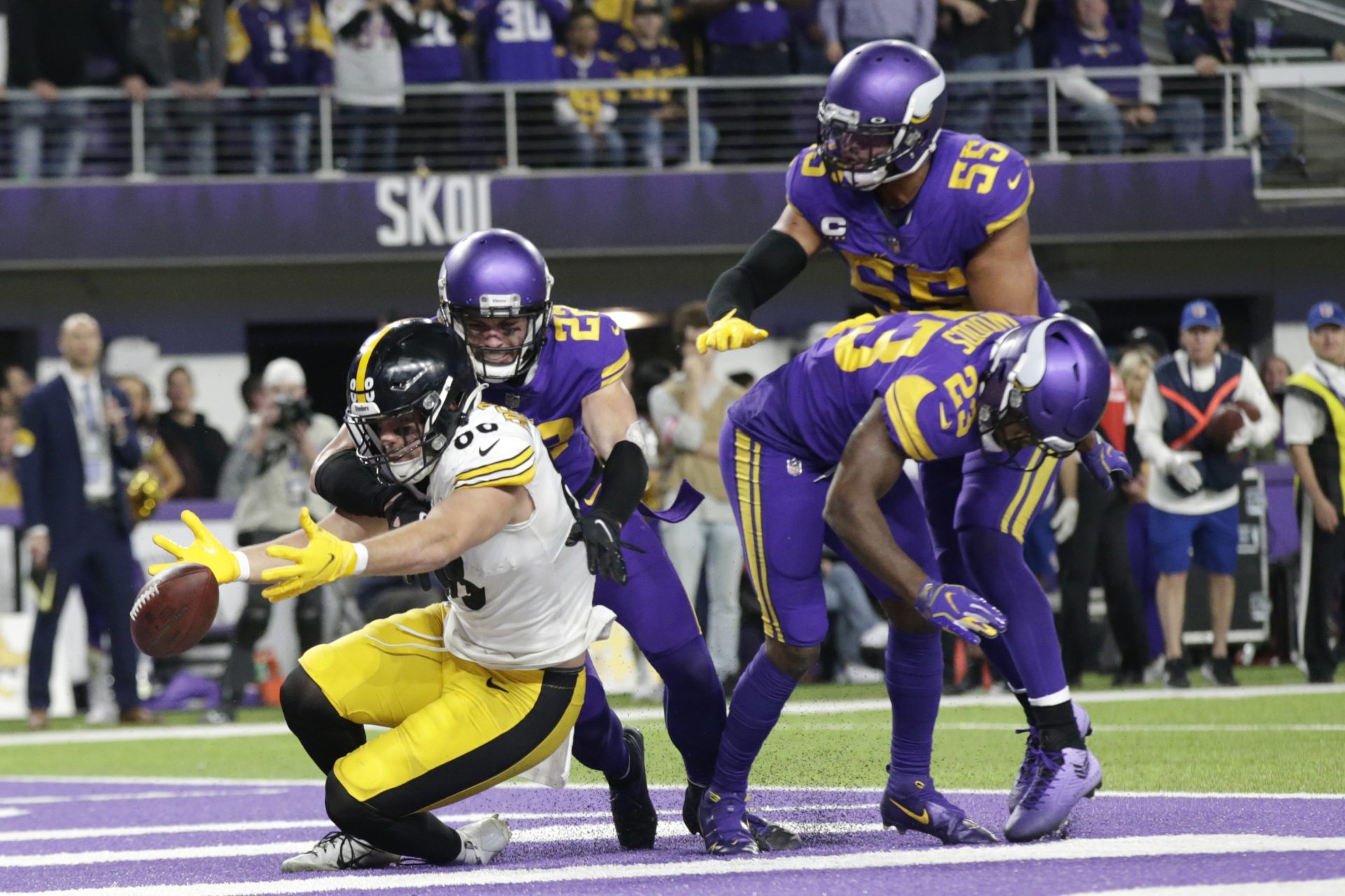 Minnesota Vikings defenders safety Harrison Smith (22), outside linebacker Anthony Barr (55) and free safety Xavier Woods (23) break up a pass intended for Pittsburgh Steelers tight end Pat Freiermuth (88) in the end zone at the end of an NFL football game, Thursday, Dec. 9, 2021, in Minneapolis. The Vikings won 36-28.