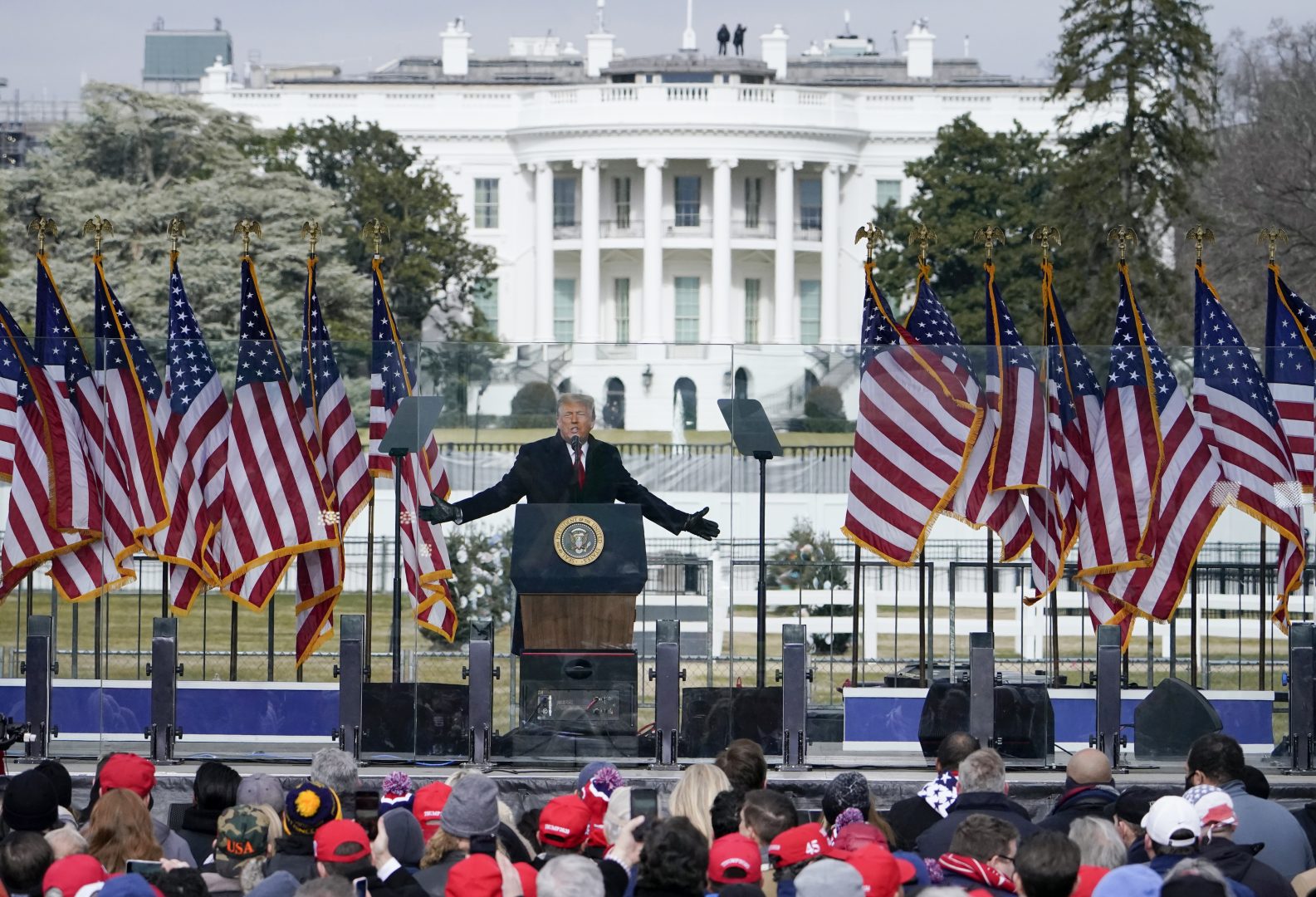 FILE - The White House in the background, President Donald Trump speaks at a rally in Washington, Jan. 6, 2021. The House committee investigating the U.S. Capitol insurrection is asking Ivanka Trump, daughter of former President Donald Trump, to voluntarily cooperate with its investigation.  (AP Photo/Jacquelyn Martin, File)