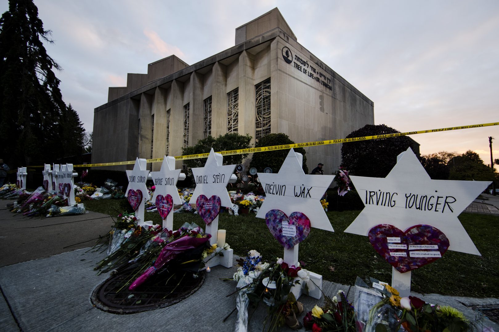 FILE - A makeshift memorial stands outside the Tree of Life Synagogue in Pittsburgh, Monday, Oct. 29, 2018 in the aftermath of a deadly shooting at the synagogue. (AP Photo/Matt Rourke, File)