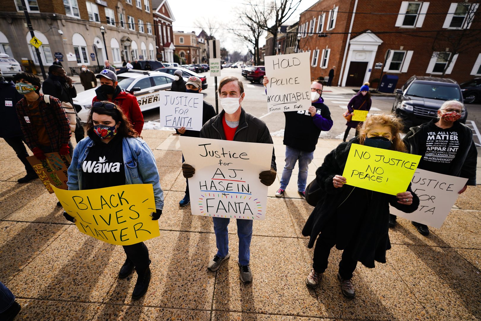 Protesters demonstrate calling for police accountability in the death of 8-year-old Fanta Bility who was shot outside a football game, at the Delaware County Courthouse in Media, Pa., Thursday, Jan. 13, 2022. Authorities say officers were responding to gunfire between two teens when Bility was fatally struck by a police bullet in 2021. 