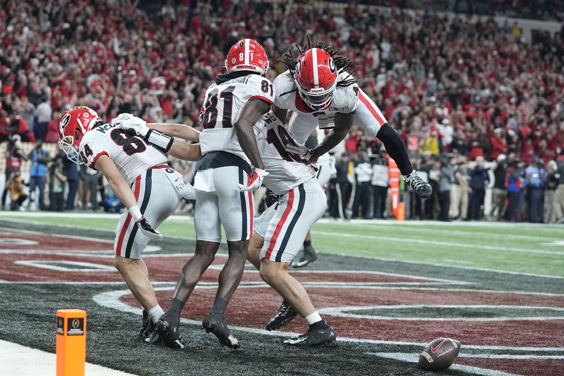 Georgia's Brock Bowers is congratulated after scoring a touchdown during the second half of the College Football Playoff championship football game against Alabama Monday, Jan. 10, 2022, in Indianapolis.