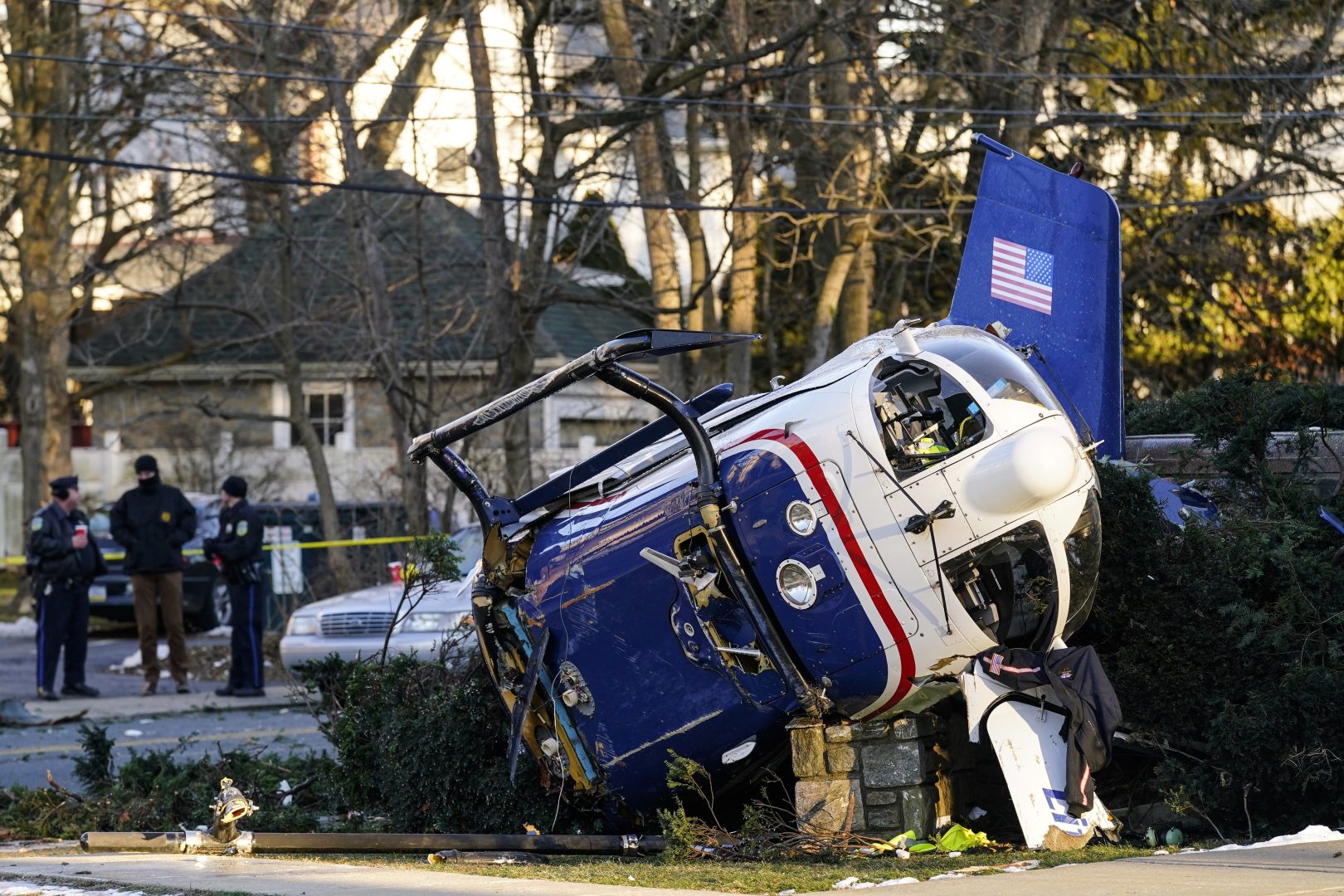 A medical helicopter rests next to the Drexel Hill United Methodist Church after it crashed in the Drexel Hill section of Upper Darby, Pa., on Tuesday, Jan. 11, 2022. 