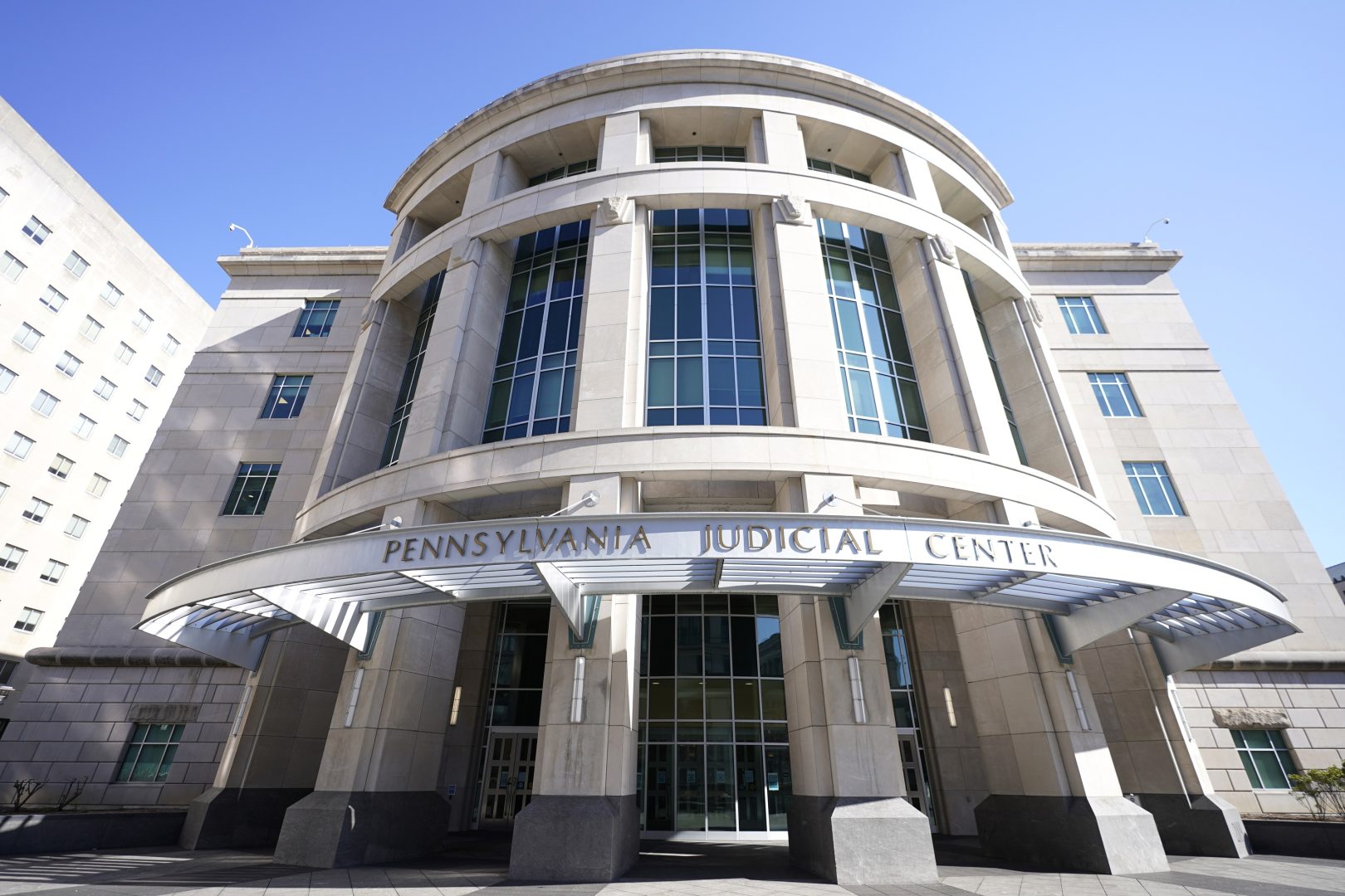 Shown is a general view of the Pennsylvania Judicial Center, home to the Commonwealth Court in Harrisburg, Pa., on Nov. 6, 2020.  A lawsuit that could result in drastic changes to how Pennsylvania funds public education goes to trial Friday, Nov. 12, 2021, in a Harrisburg courtroom, seven years after a handful of the state’s districts first went to court to challenge a system they consider unfair. 