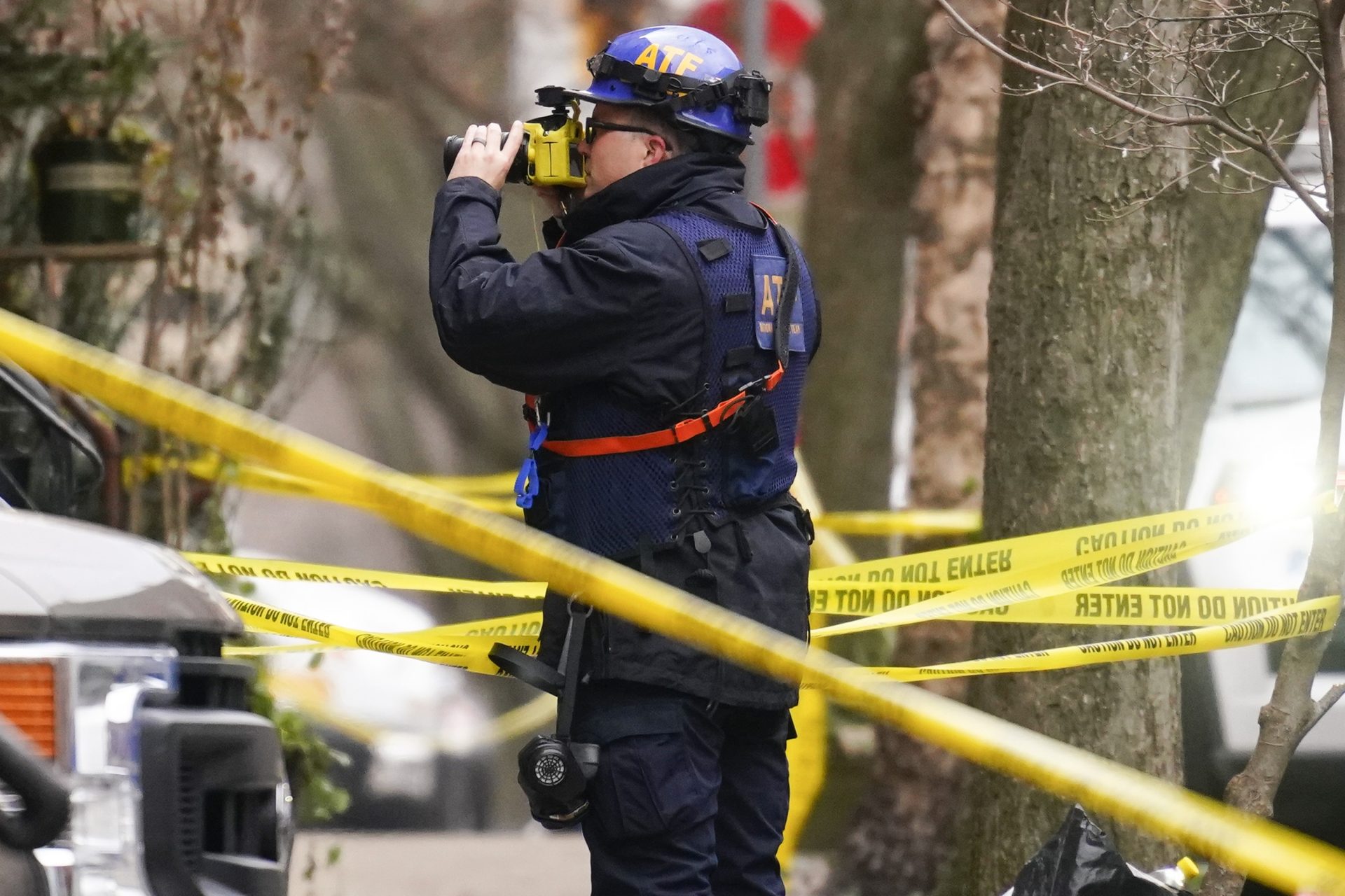 Investigators photograph the scene of Wednesday's fatal fire in the Fairmount neighborhood of Philadelphia, Thursday, Jan. 6, 2022. Officials say it's the city's deadliest single fire in at least a century.