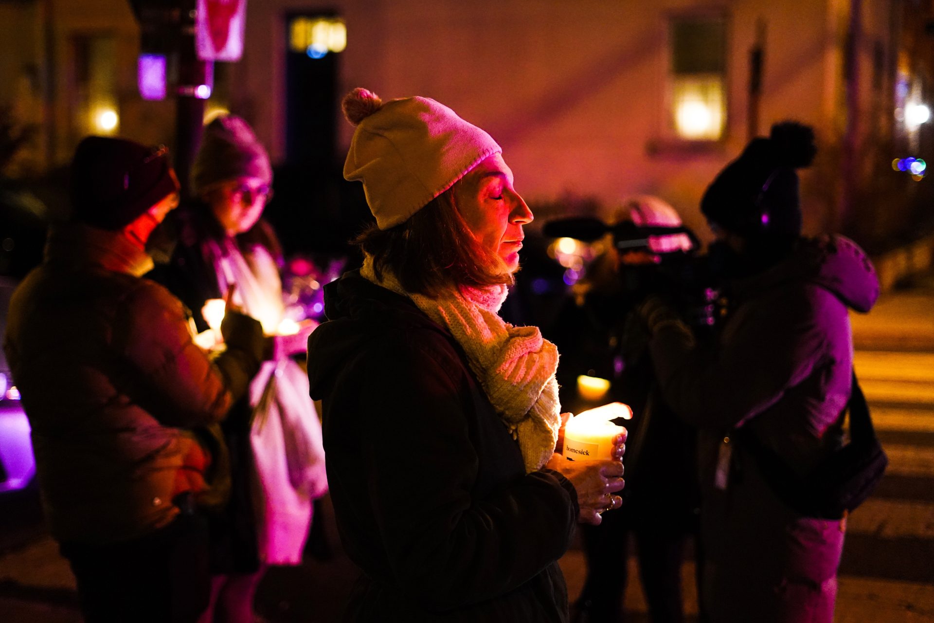 People gather to pay their respects after a deadly row house fire, Wednesday, Jan. 5, 2022, in the Fairmount neighborhood of Philadelphia.