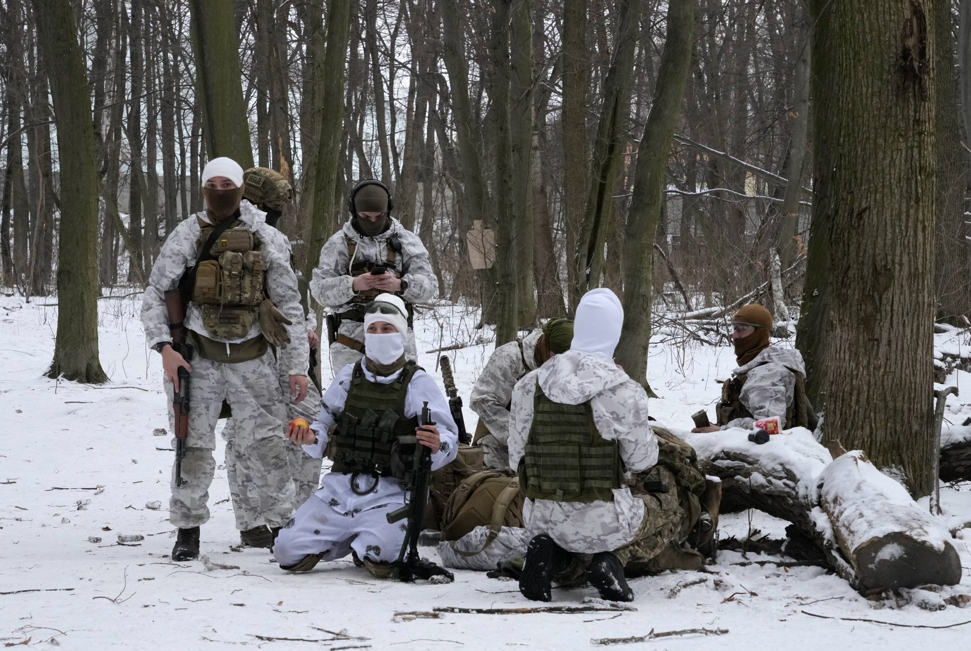Members of Ukraine's Territorial Defense Forces, volunteer military units of the Armed Forces, train in a city park in Kyiv, Ukraine, Saturday, Jan. 22, 2022.