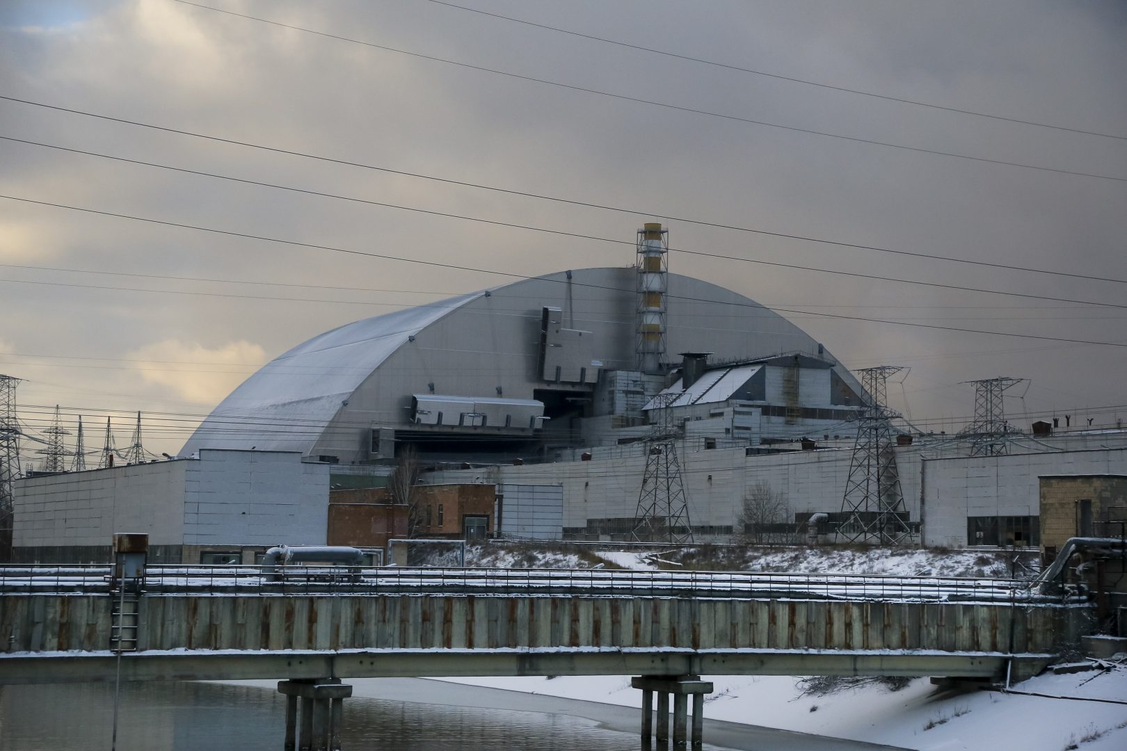 A new shelter is installed over the exploded reactor at the Chernobyl nuclear plant, Chernobyl, Ukraine, Tuesday, Nov. 29, 2016. A massive shelter has finally been installed over the exploded reactor at the Chernobyl nuclear plant, one of the most ambitious engineering projects in the world. (AP Photo/Efrem Lukatsky)