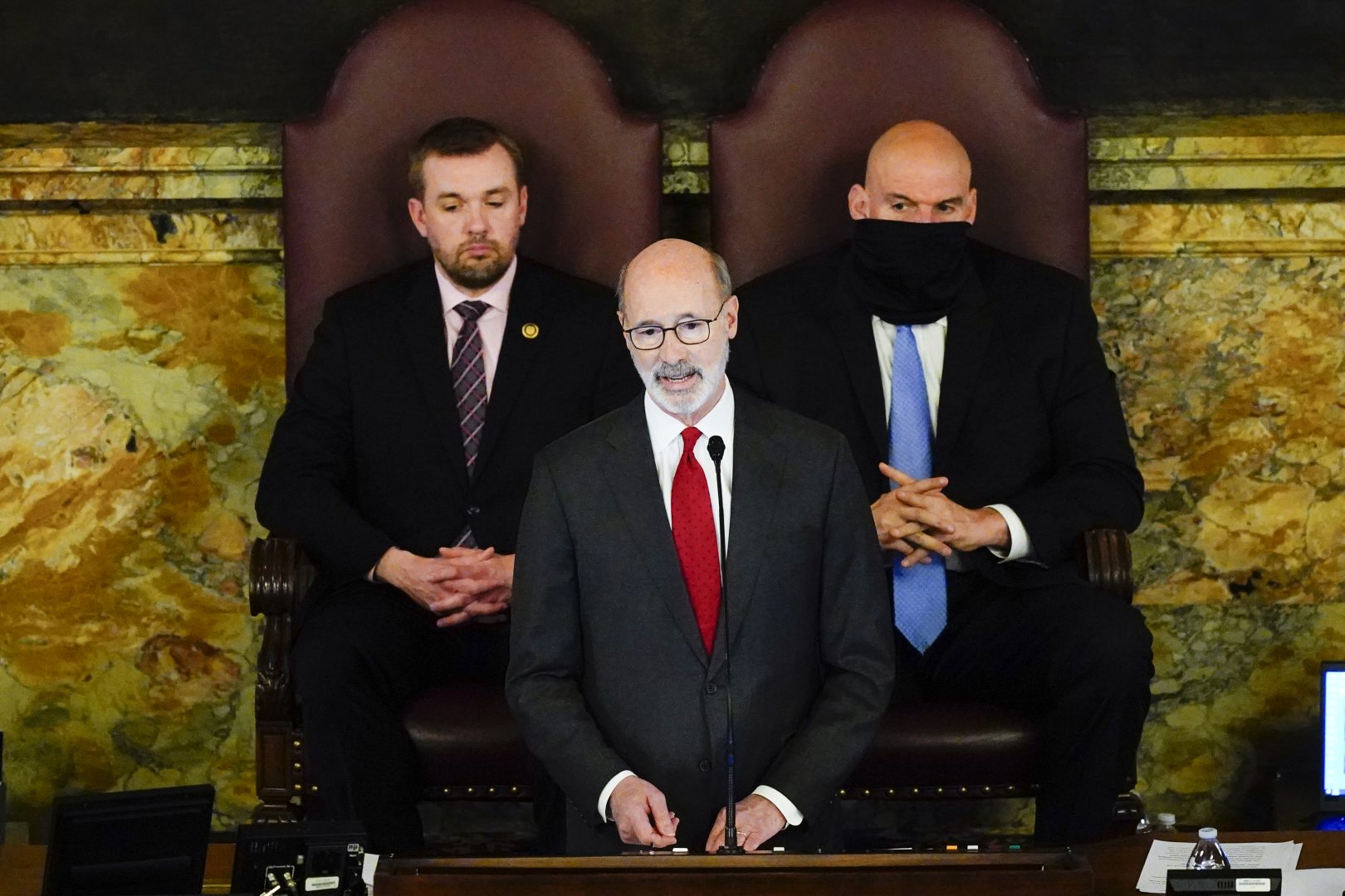Democratic Gov. Tom Wolf delivers his budget address for the 2022-23 fiscal year to a joint session of the Pennsylvania House and Senate in Harrisburg, Pa., Tuesday, Feb. 8, 2022. Wolf is accompanied by House Speaker Bryan Cutler, R-Lancaster, left, and Lt. Gov. John Fetterman.