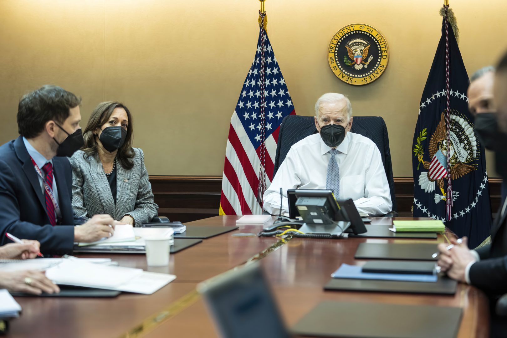 In this image provided by The White House, President Joe Biden and Vice President Kamala Harris and members of the President's national security team observe from the Situation Room at the White House in Washington, on Wednesday, Feb. 2, 2022, the counterterrorism operation responsible for removing from the battlefield Abu Ibrahim al-Hashimi al-Qurayshi, the leader of the Islamic State group. (Adam Schultz/The White House via AP)