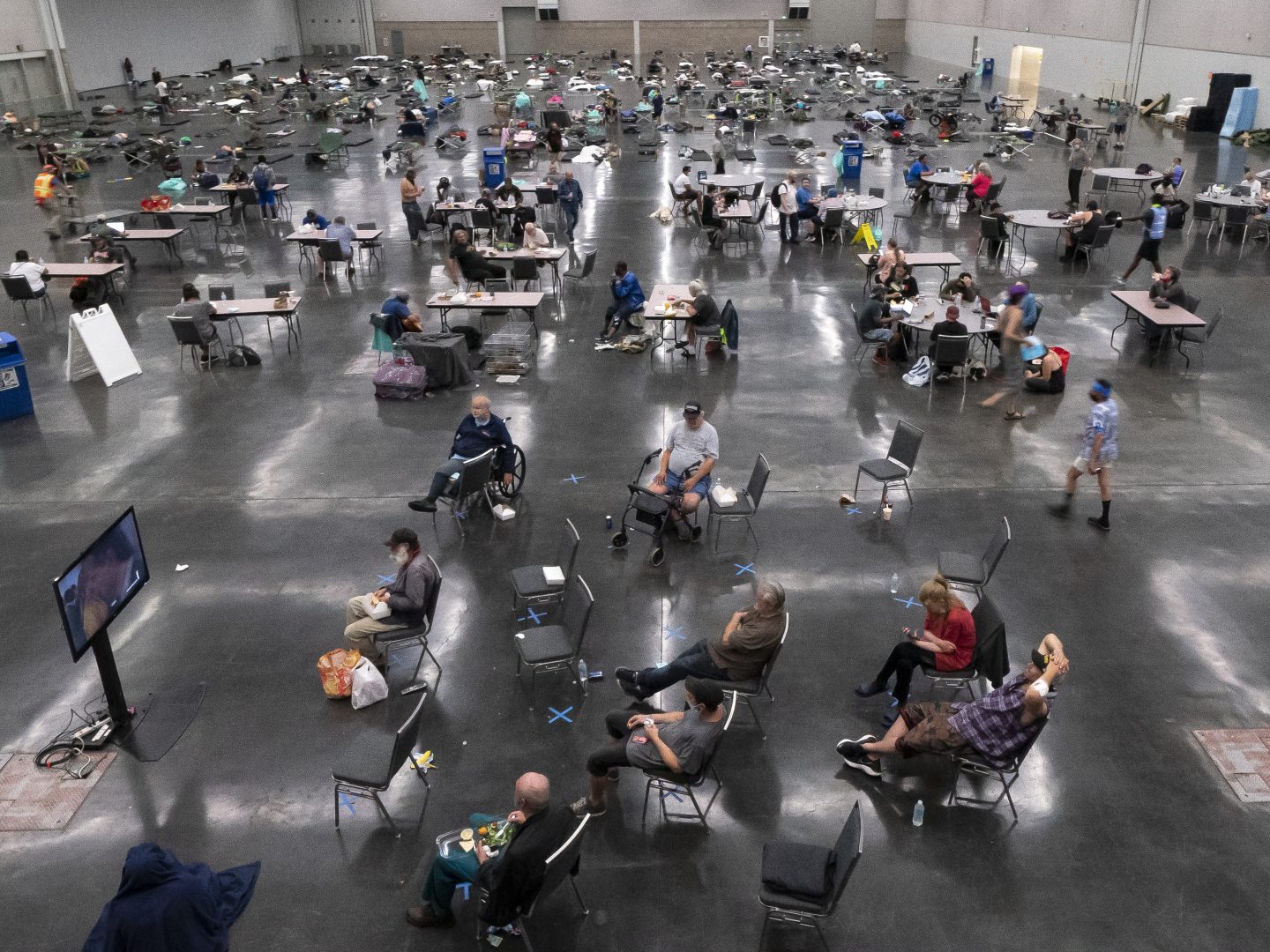 PORTLAND, OR - JUNE 27: Portland residents fill a cooling center with a capacity of about 300 people at the Oregon Convention Center June 27, 2021 in Portland, Oregon. Record breaking temperatures lingered over the Northwest during a historic heatwave this weekend. (Photo by Nathan Howard/Getty Images)