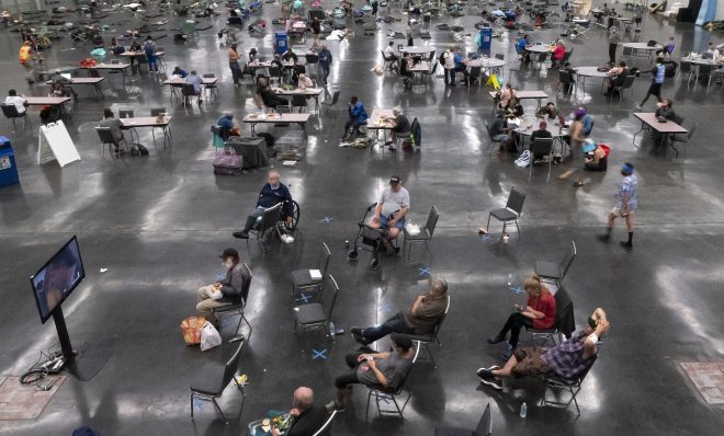 PORTLAND, OR - JUNE 27: Portland residents fill a cooling center with a capacity of about 300 people at the Oregon Convention Center June 27, 2021 in Portland, Oregon. Record breaking temperatures lingered over the Northwest during a historic heatwave this weekend. (Photo by Nathan Howard/Getty Images)