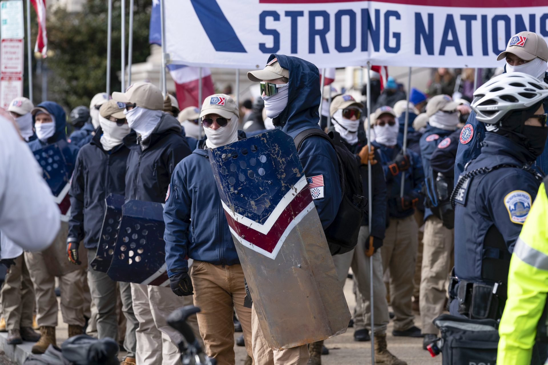 Members of the white supremacist group Patriot Front demonstrate near the National Archives in Washington, Friday, Jan. 21, 2022.