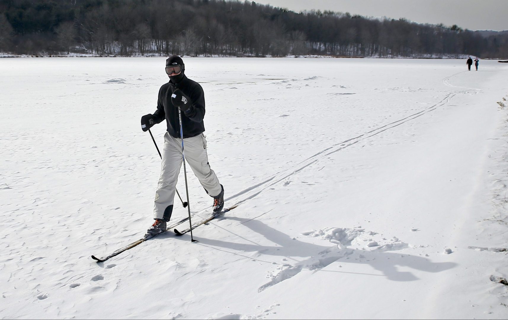 John Delcamp cross country skis along the edge of the frozen Lake Arthur in Moraine State Park while temperatures were in the single digits, Saturday, Jan. 6, 2018, in Portersville, Pa. Pennsylvanians continue to deal with bone-chilling temperatures and related weather issues that have gripped the state in recent weeks. 