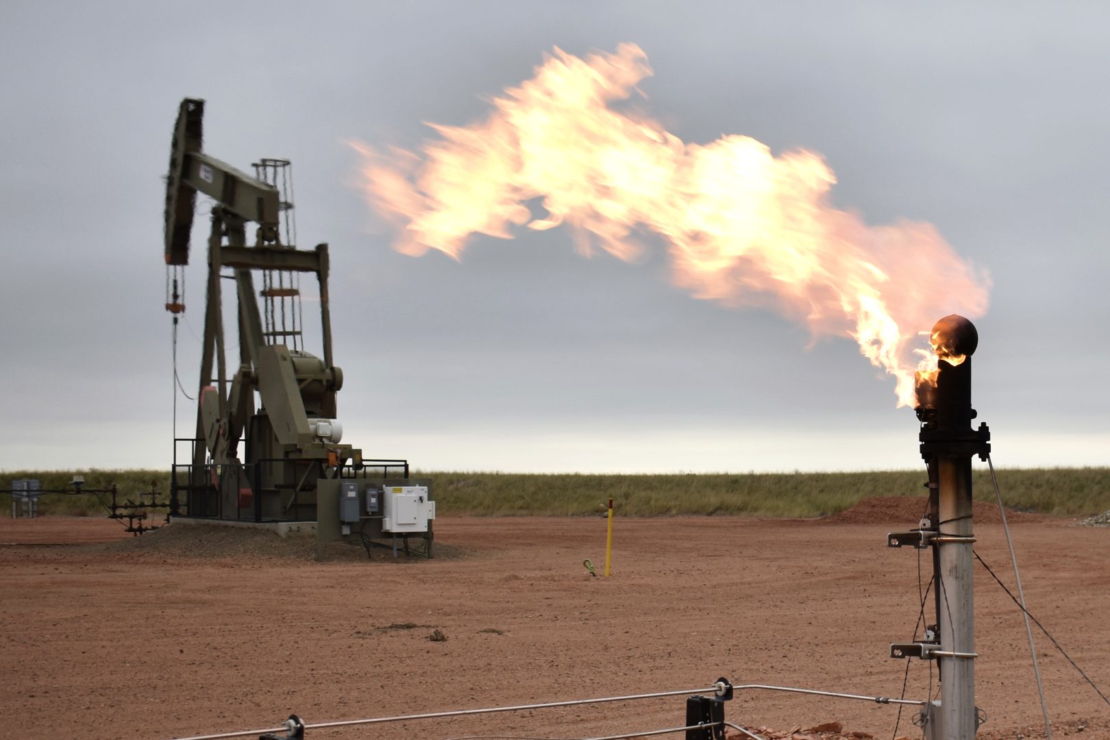 FILE - A flare burns excess natural gas at an oil well on Aug. 26, 2021, in Watford City, N.D. Republican politicians across the U.S. are criticizing President Joe Biden over his domestic energy policies and urging his administration to do more to ramp up domestic production. 